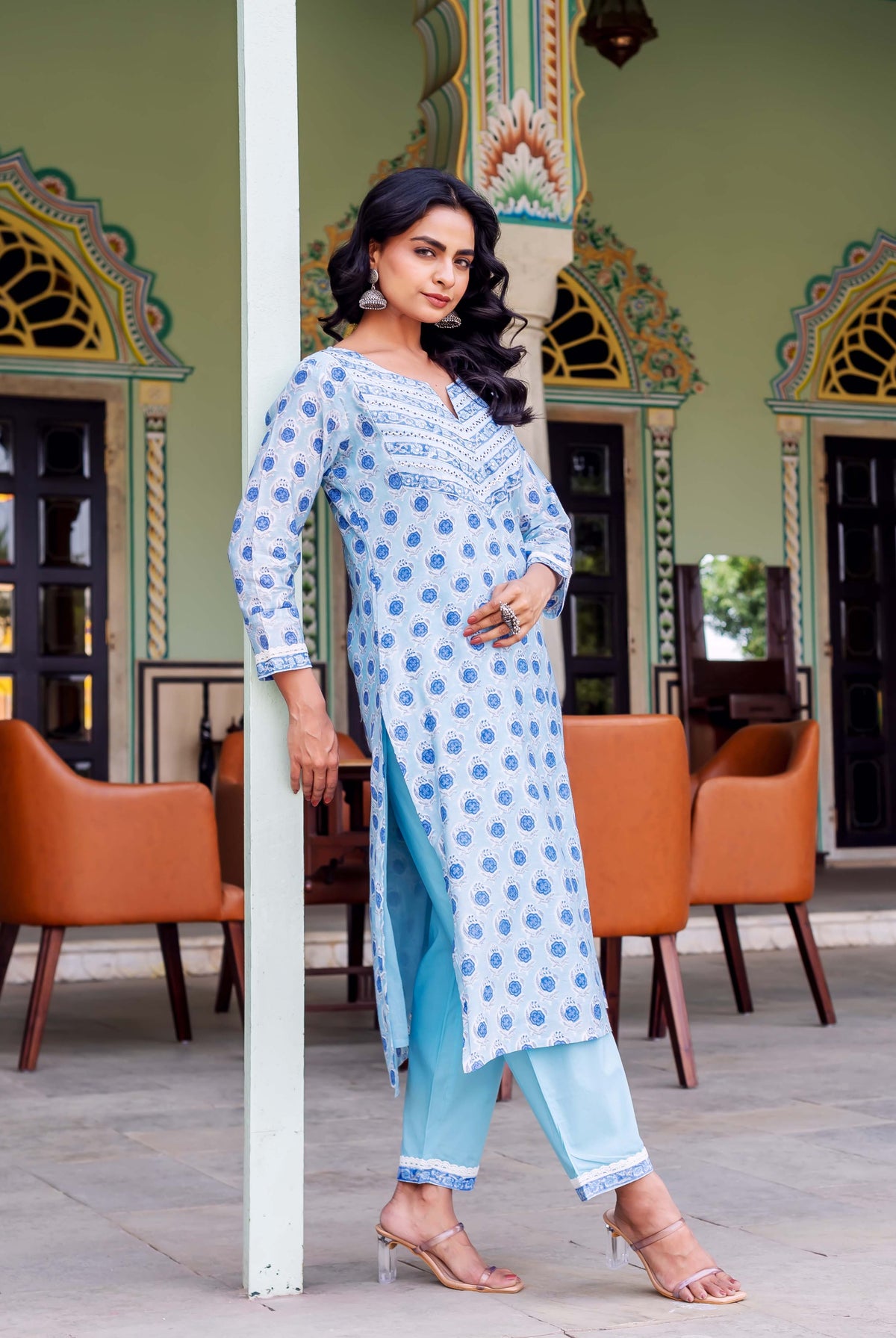 Full-length photo: model in a light blue block-printed kurta and matching pants.