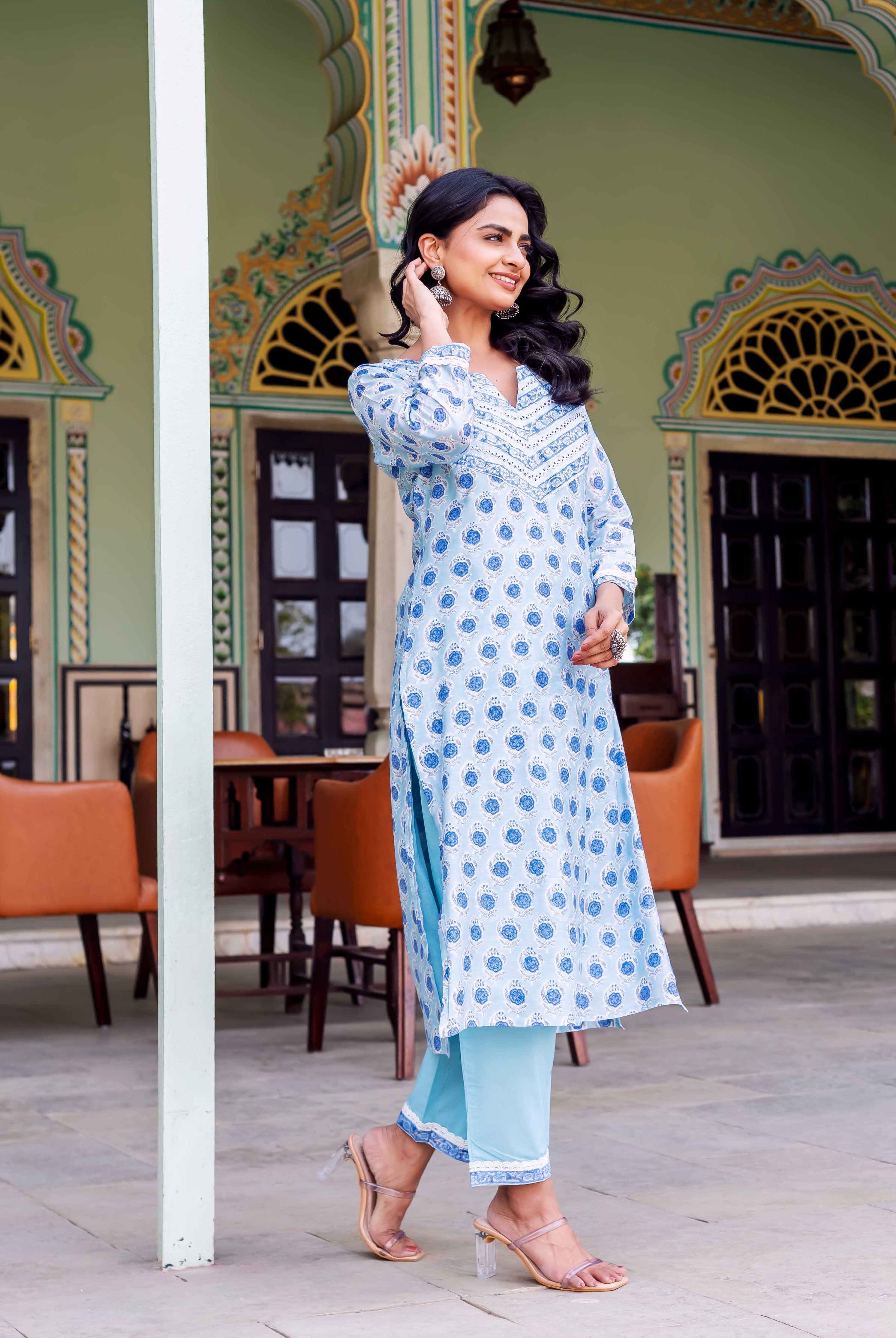 Smiling woman models full-length Rhea Blue Chanderi Kurta, light blue hand-block printed ethnic set.