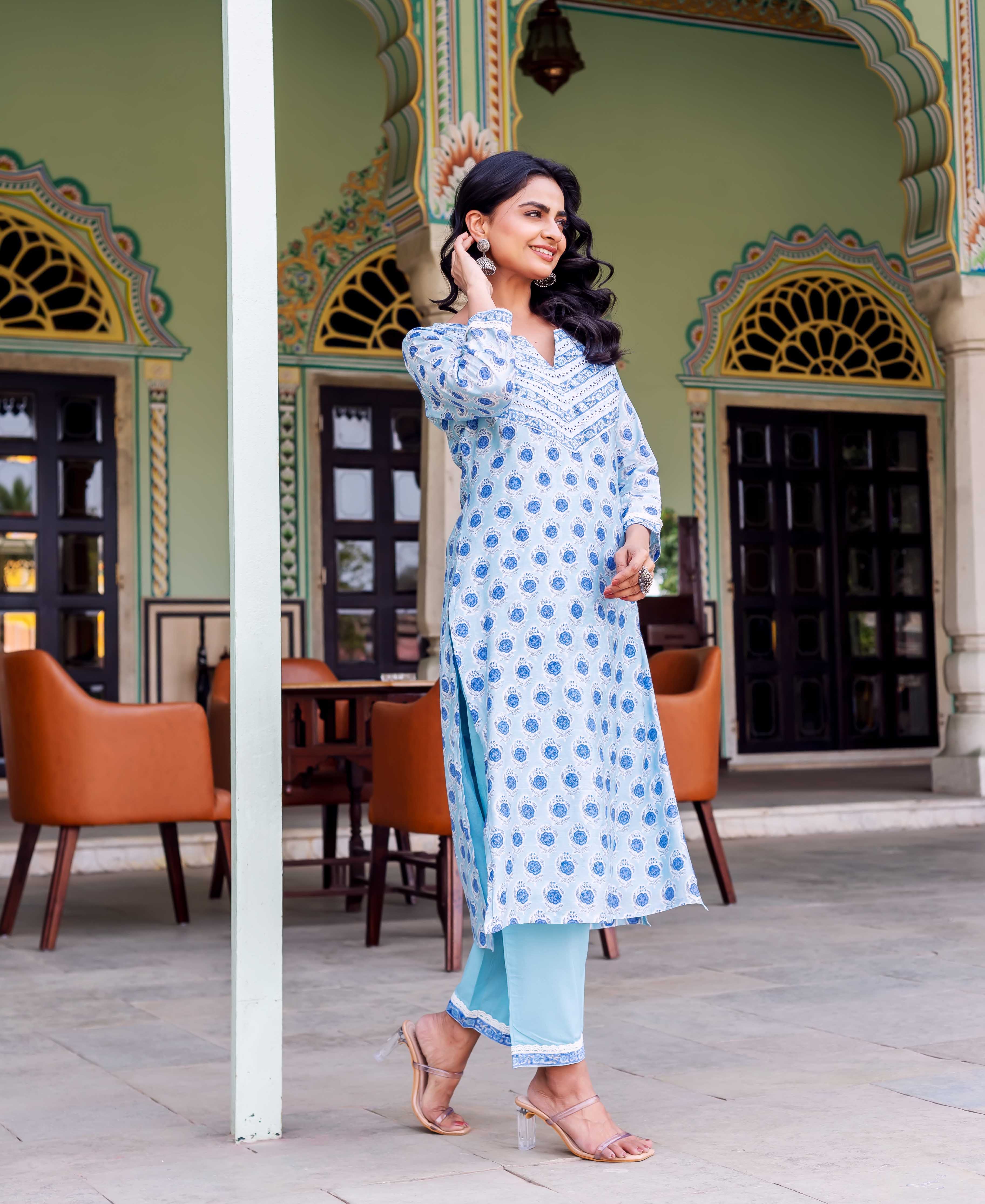 Smiling woman models full-length Rhea Blue Chanderi Kurta, light blue hand-block printed ethnic set.