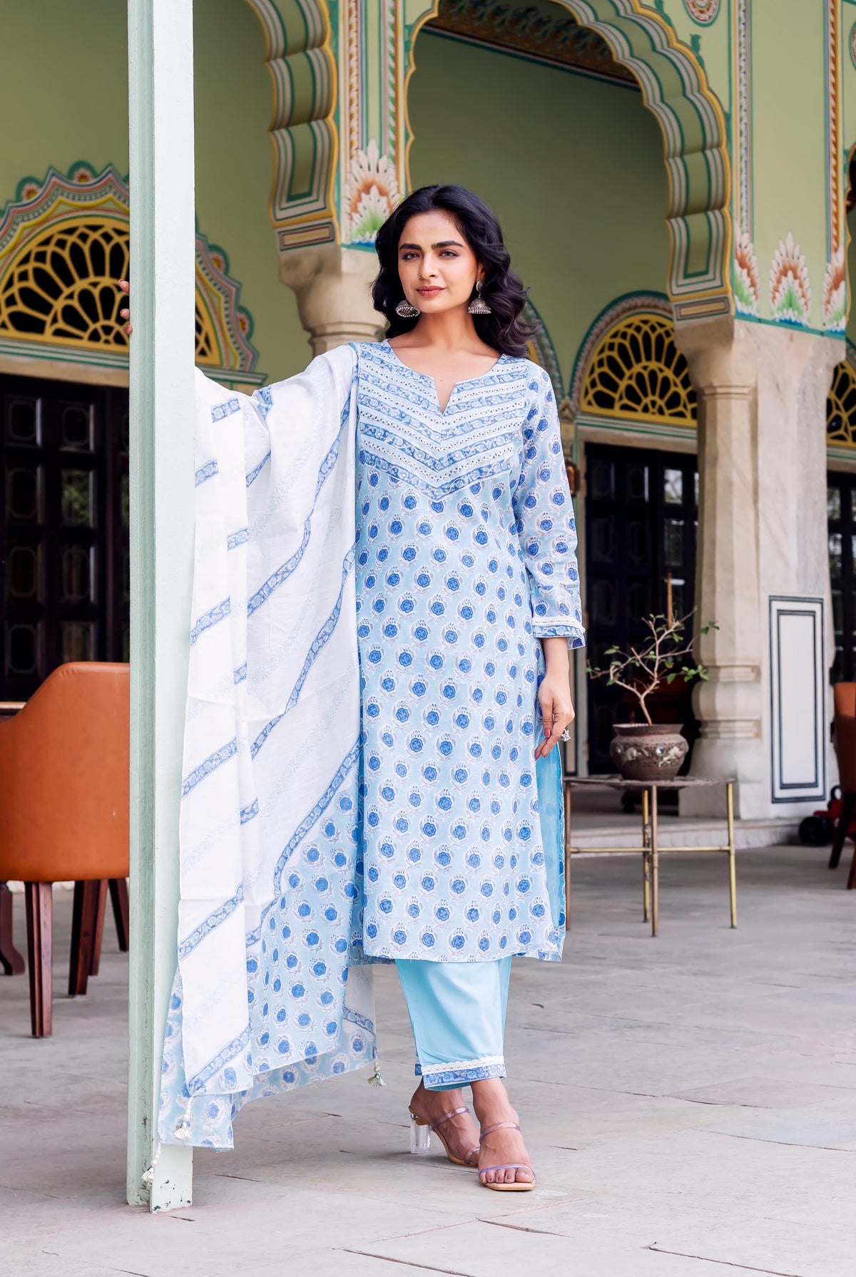 Model wearing light blue hand-block printed ethnic kurta, matching pants, and white patterned dupatta.