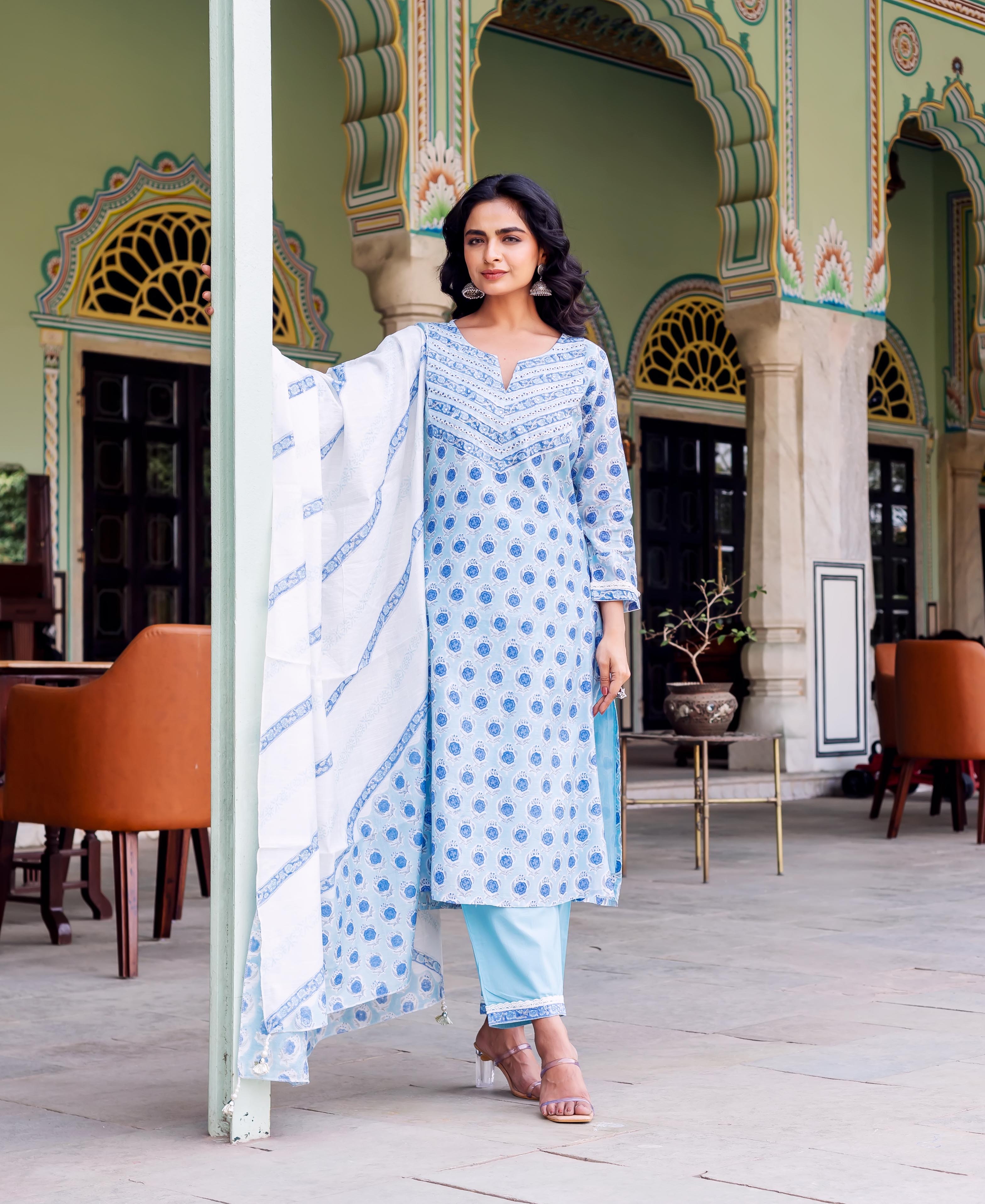 Model wearing light blue hand-block printed ethnic kurta, matching pants, and white patterned dupatta.