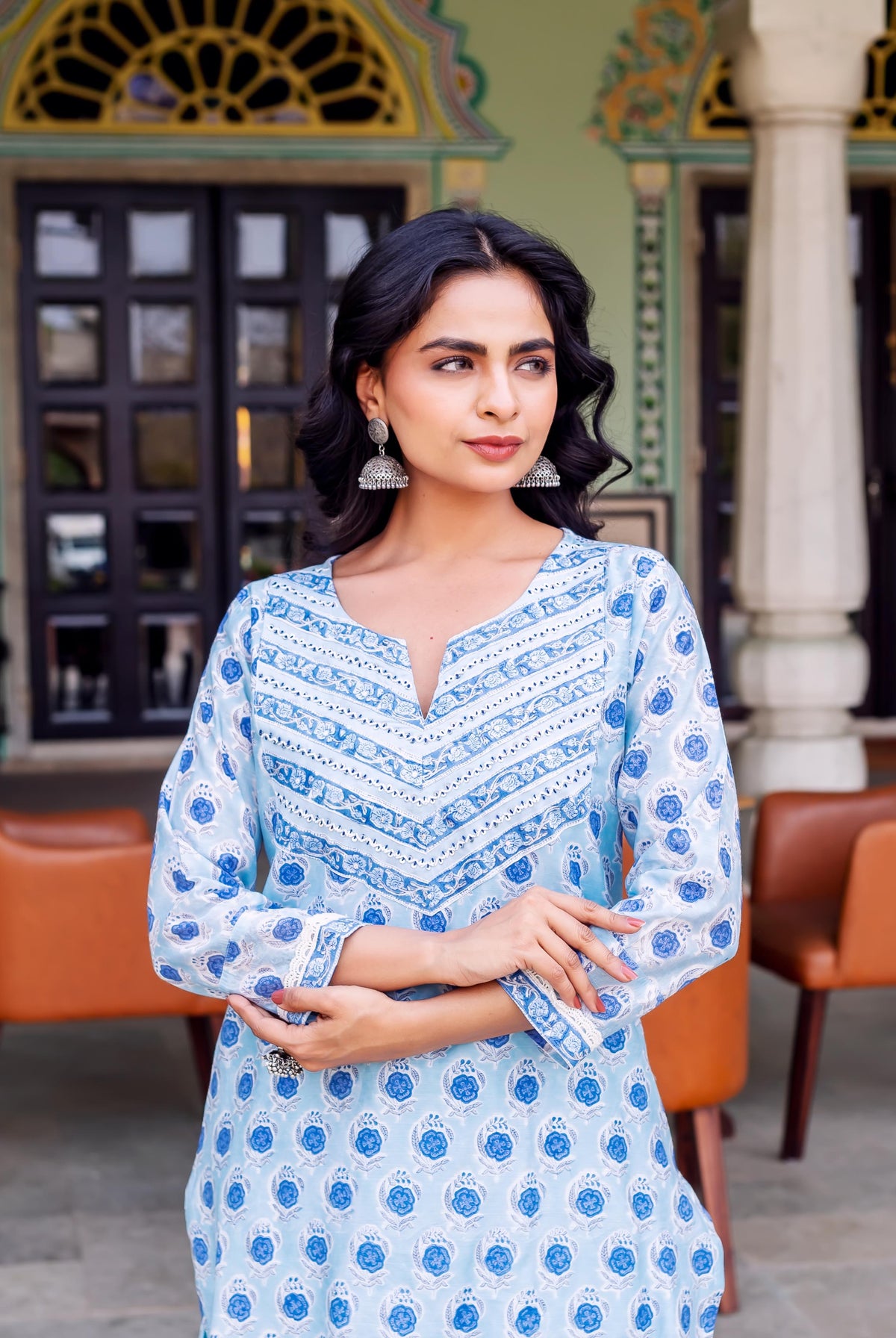 Model wears light blue hand-block printed Chanderi kurta featuring blue floral and geometric patterns.