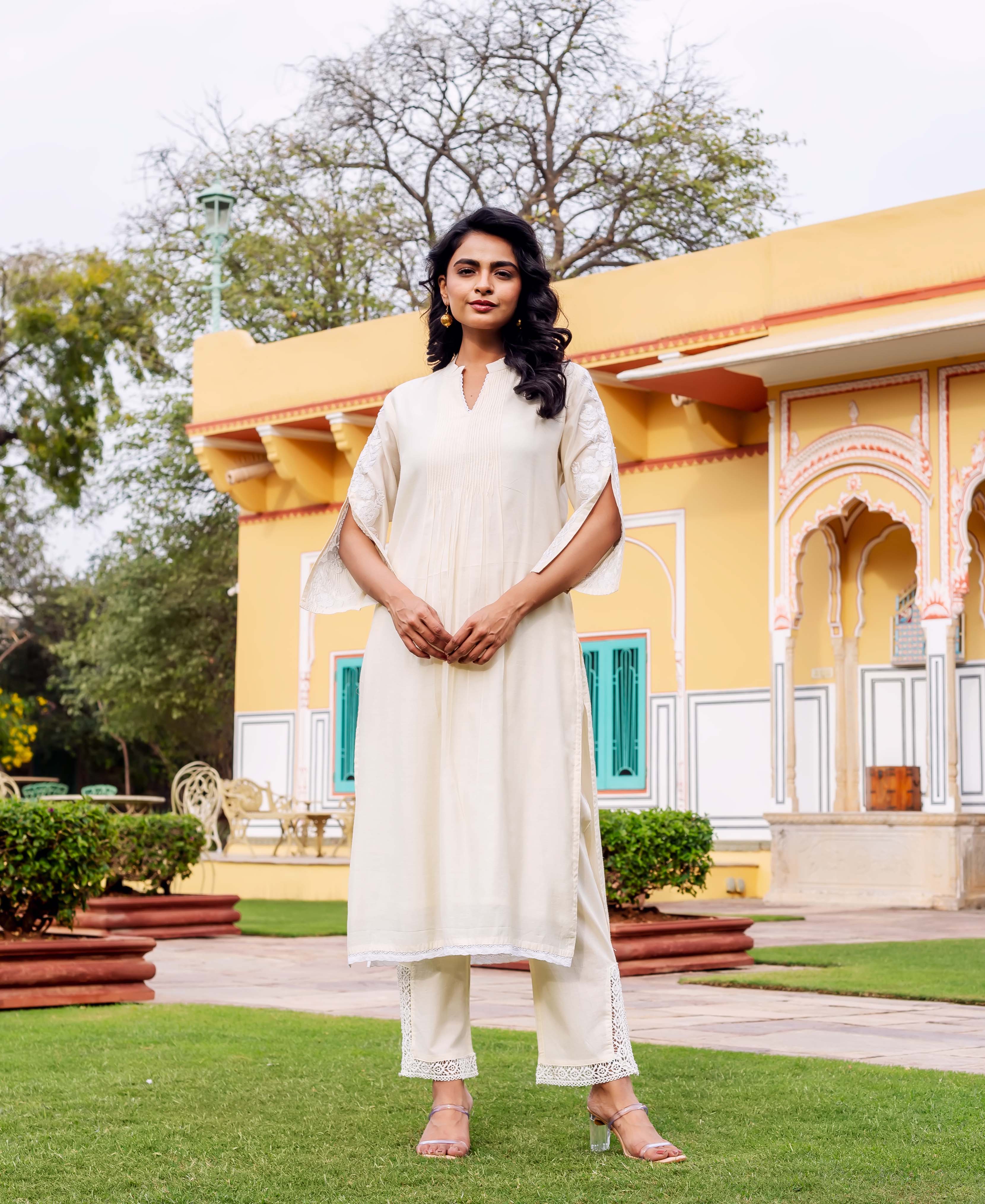 Model wearing Antique White Silk Chanderi Kurta full look, with subtle ethnic print and lace.