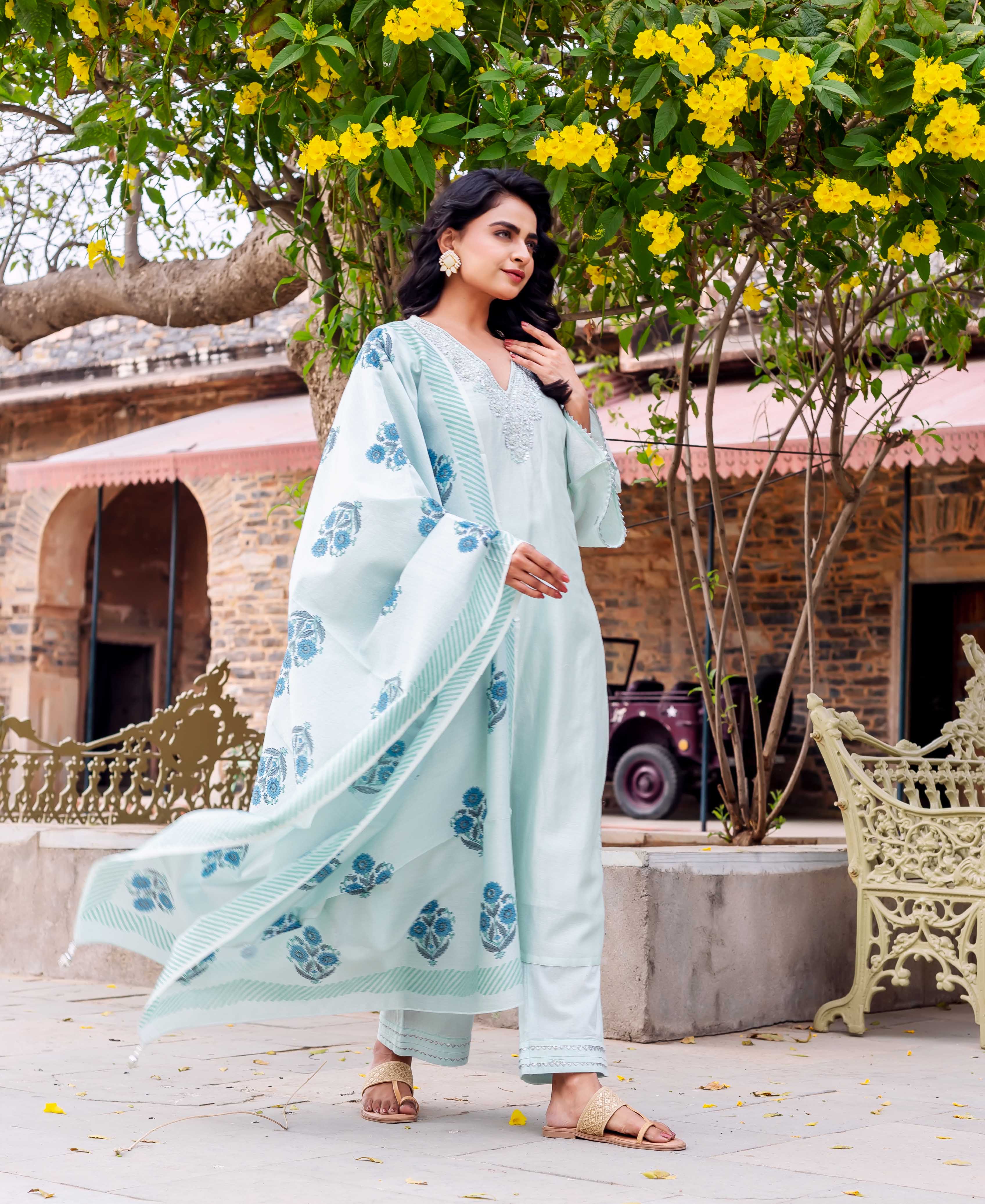 Model wearing mint Chanderi silk kurta set with embroidered neckline and blue hand-block-printed dupatta.
