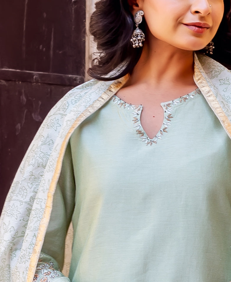 Mint green kurta with embroidered V-neck and block-printed dupatta draped on model.