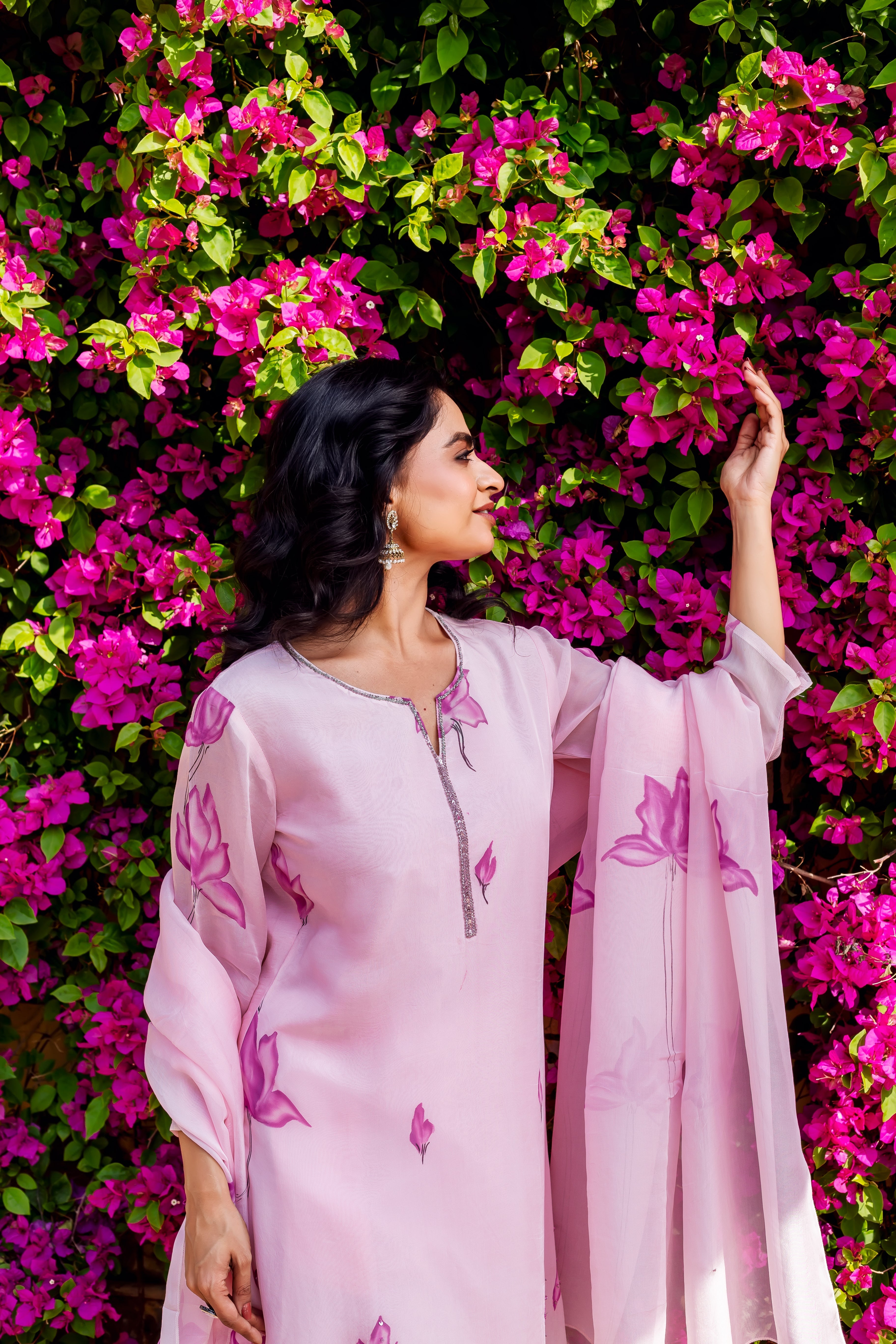 Light pink organza kurta with purple floral hand-block print and matching dupatta on model.