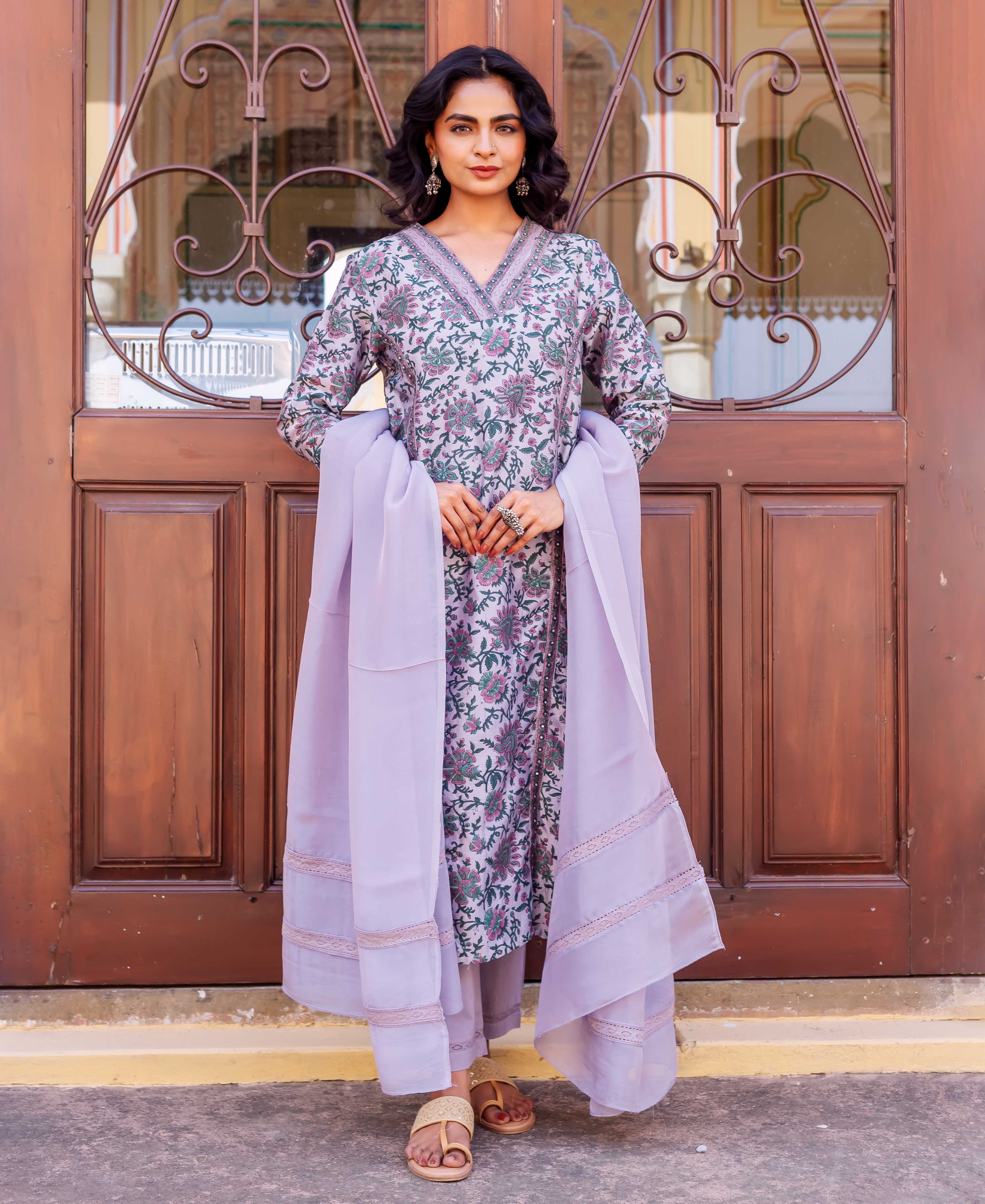 Front view of model in lavender hand-block printed floral ethnic kurta set with dupatta.