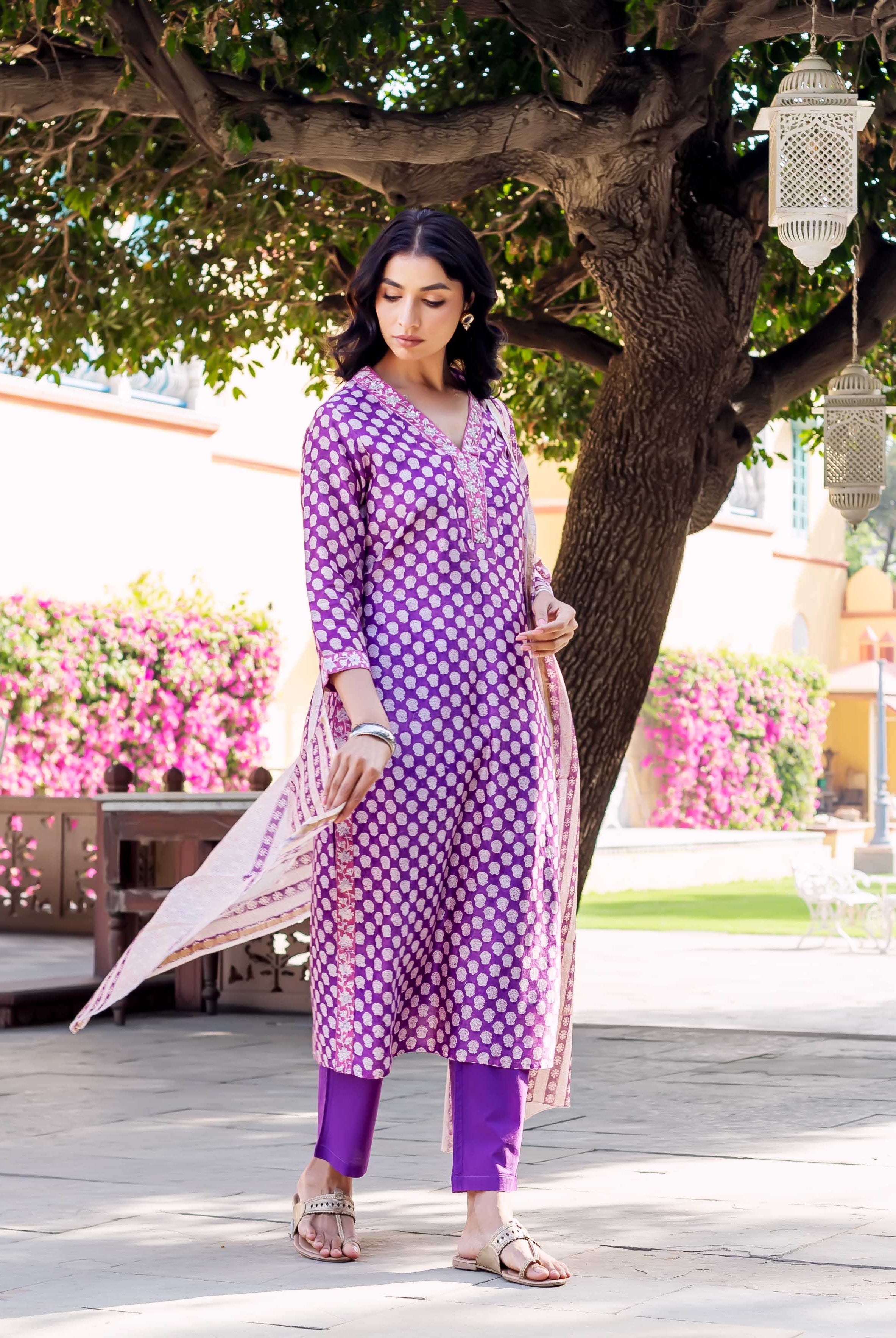 Front view of model wearing a purple hand-block-printed Chanderi kurta set with white dot print.