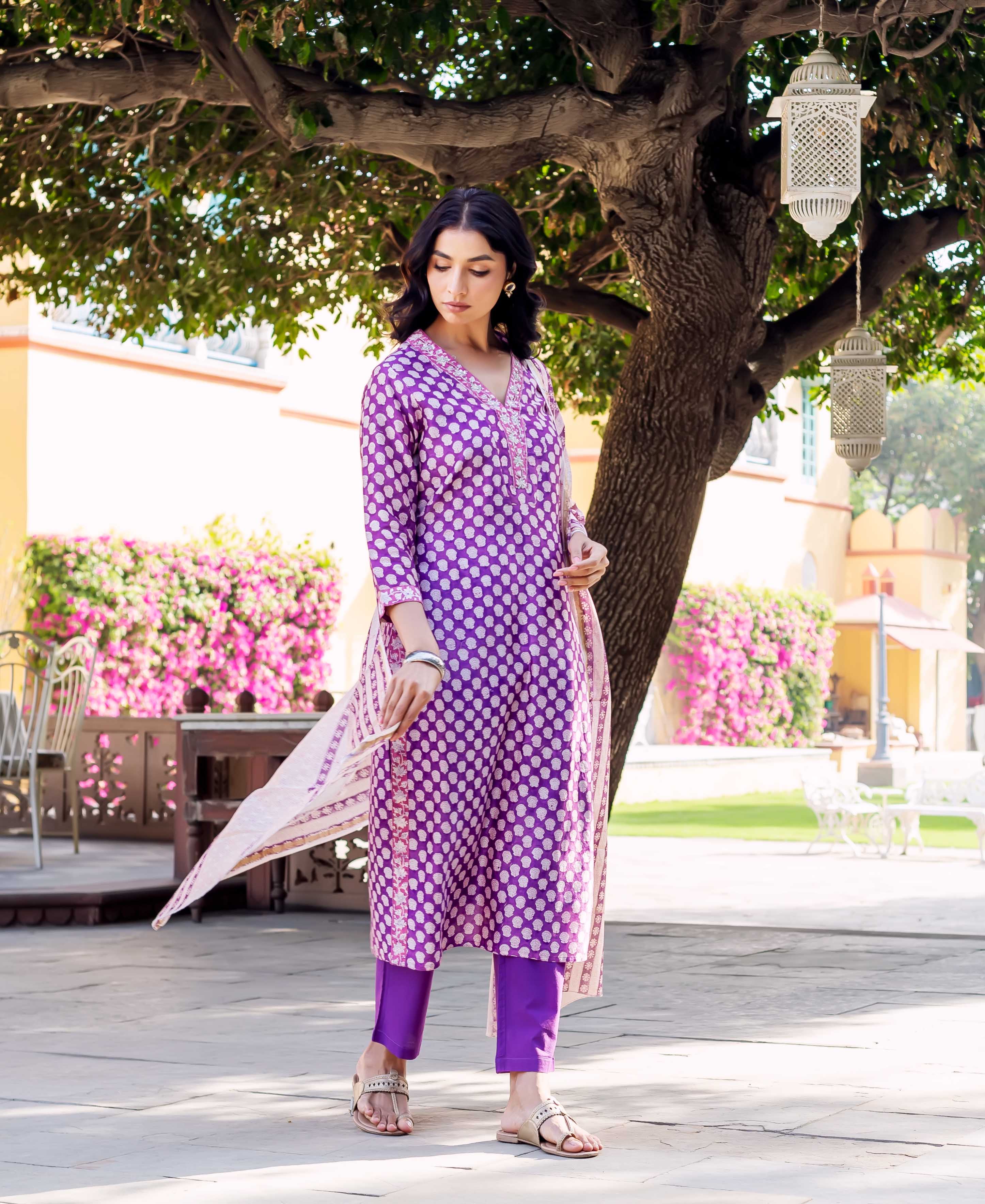 Front view of model wearing a purple hand-block-printed Chanderi kurta set with white dot print.