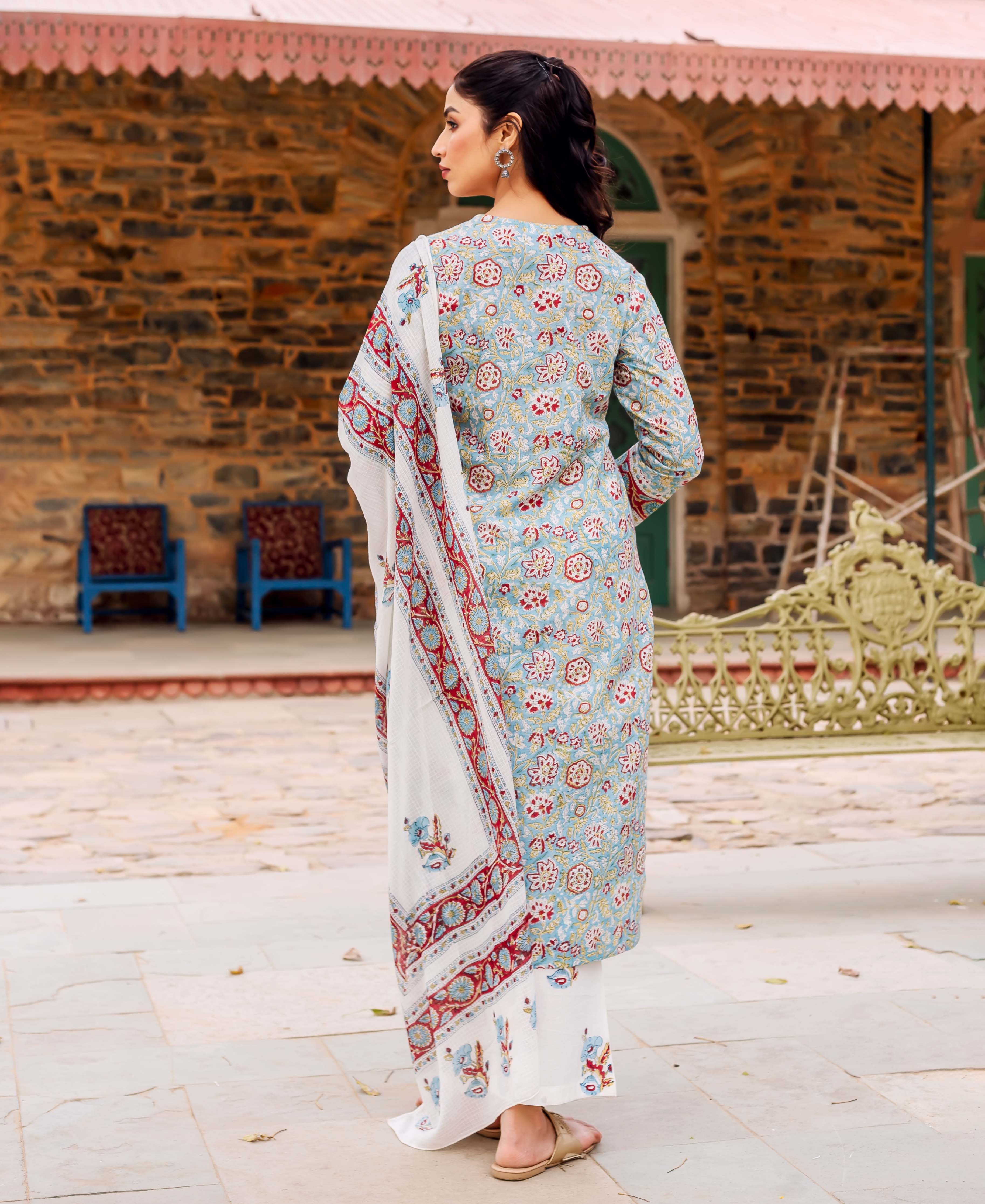 Model wears a teal hand-block printed cotton kurta set with a white patterned dupatta.