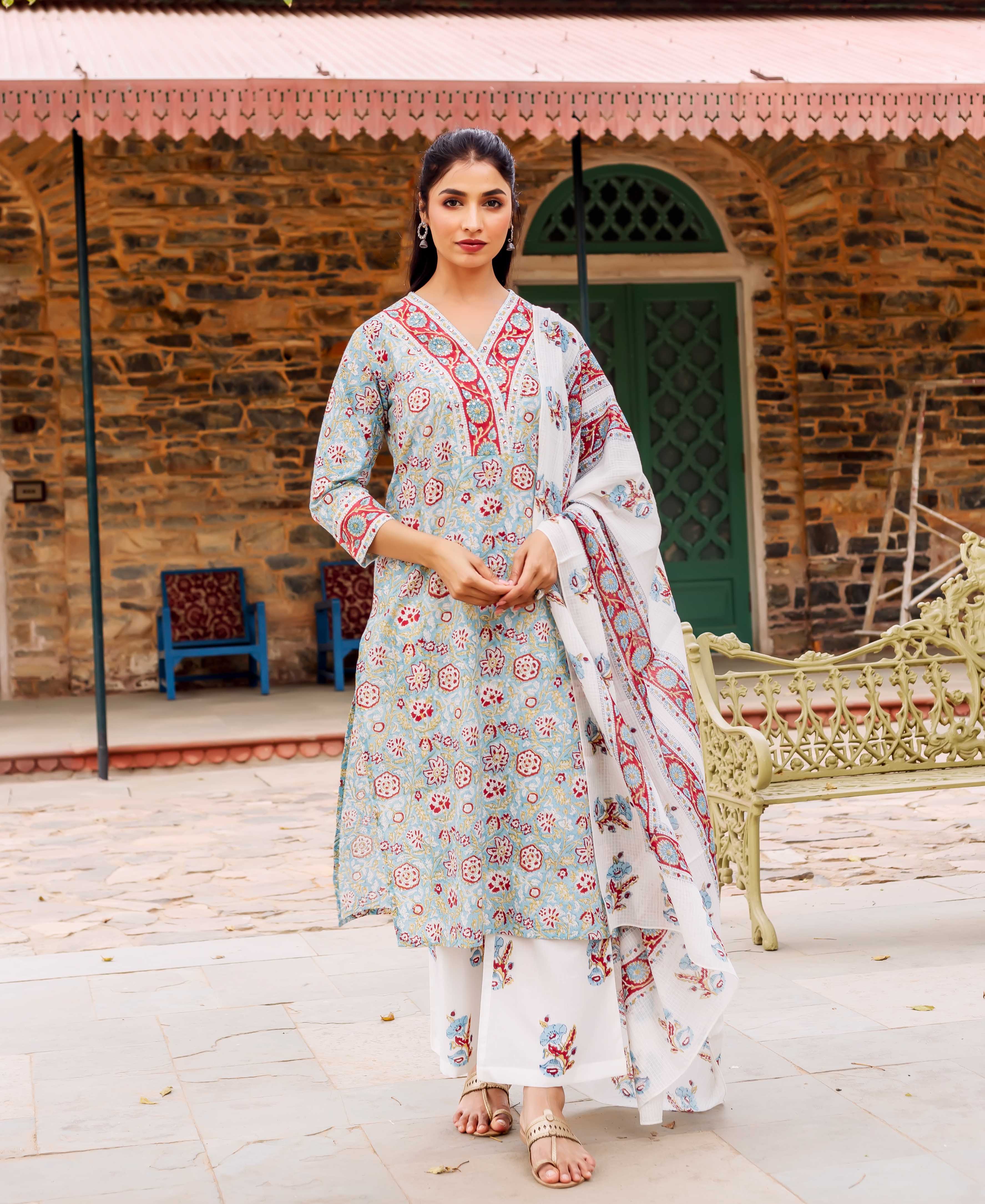 Model wearing a teal, red, and white hand-block printed cotton kurta set, full view.