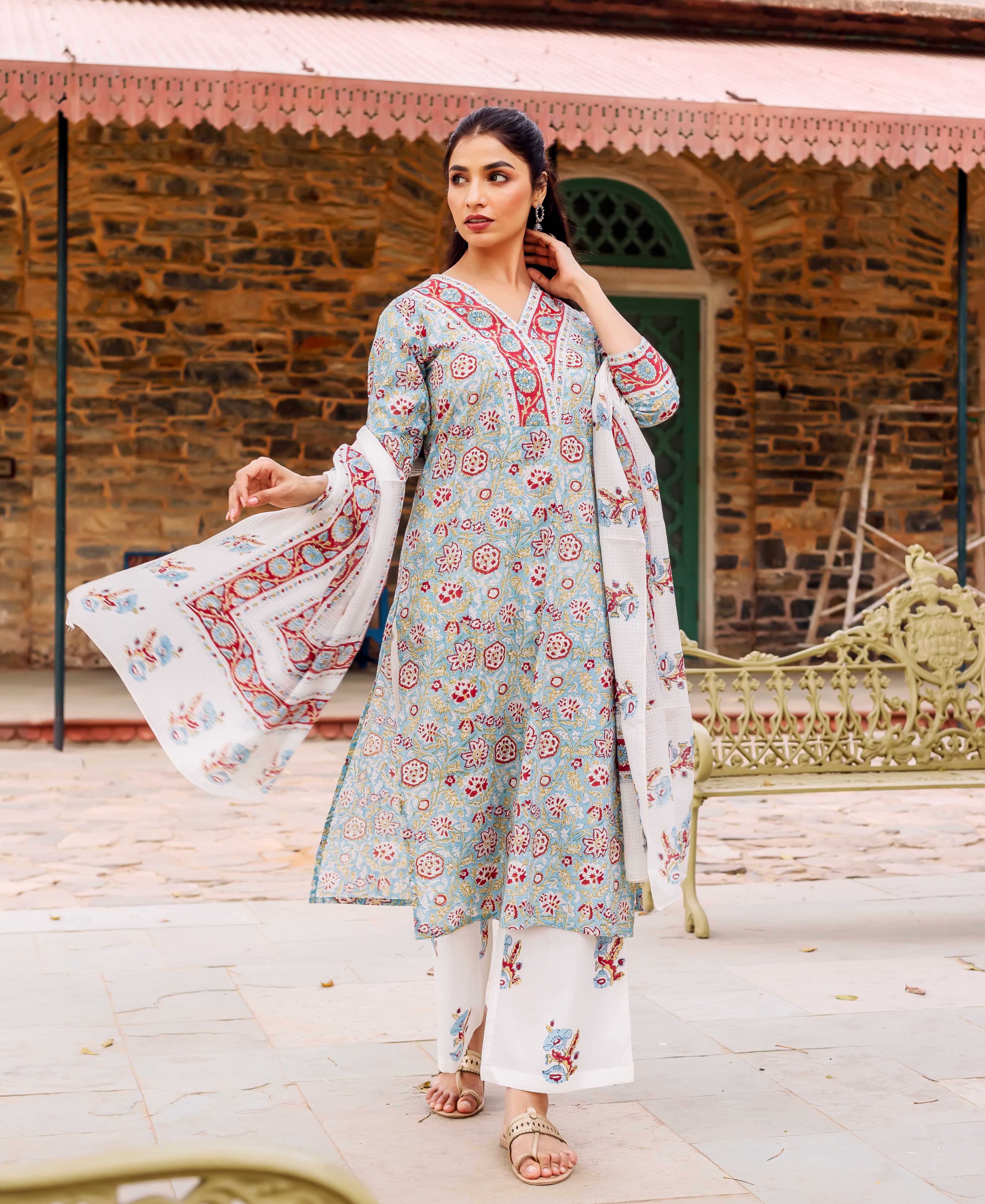Full shot of model wearing teal hand-block printed cotton kurta set with floral design.