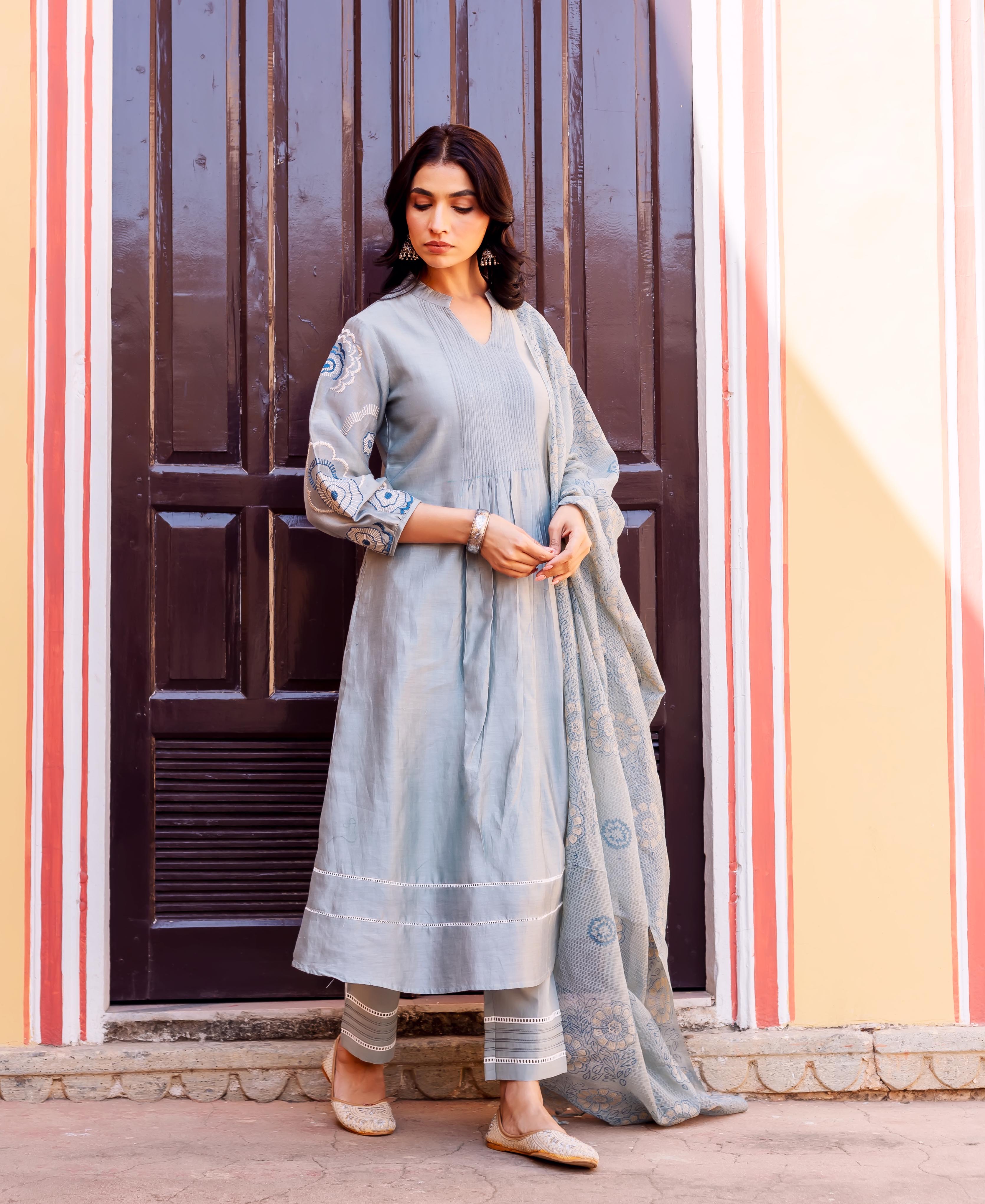 Full-body model in slate blue chanderi silk kurta set, with hand-block-printed patterns.