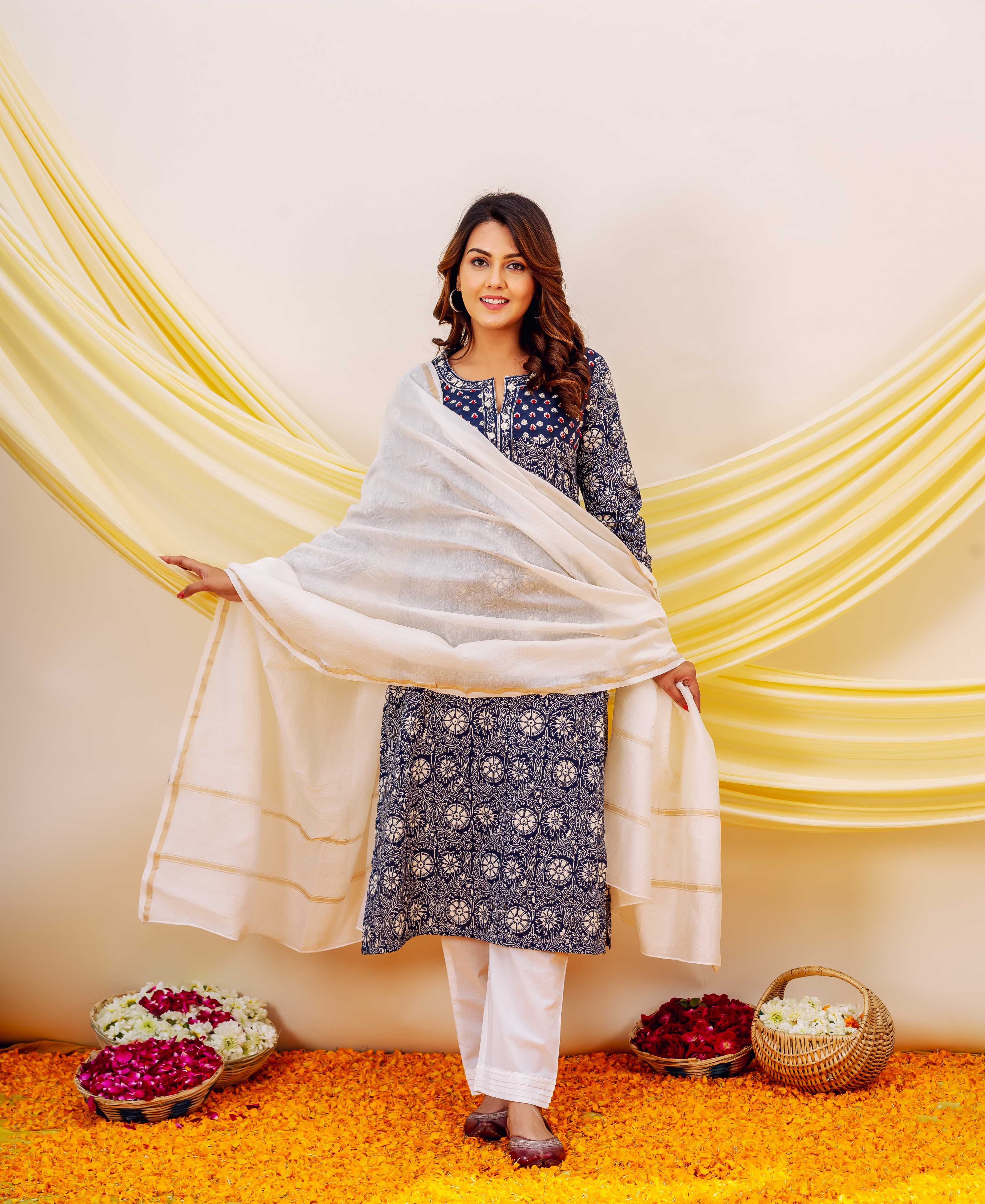 Solid white chanderi dupatta with gold stripes, draped over a model's outfit with blue and white patterns.