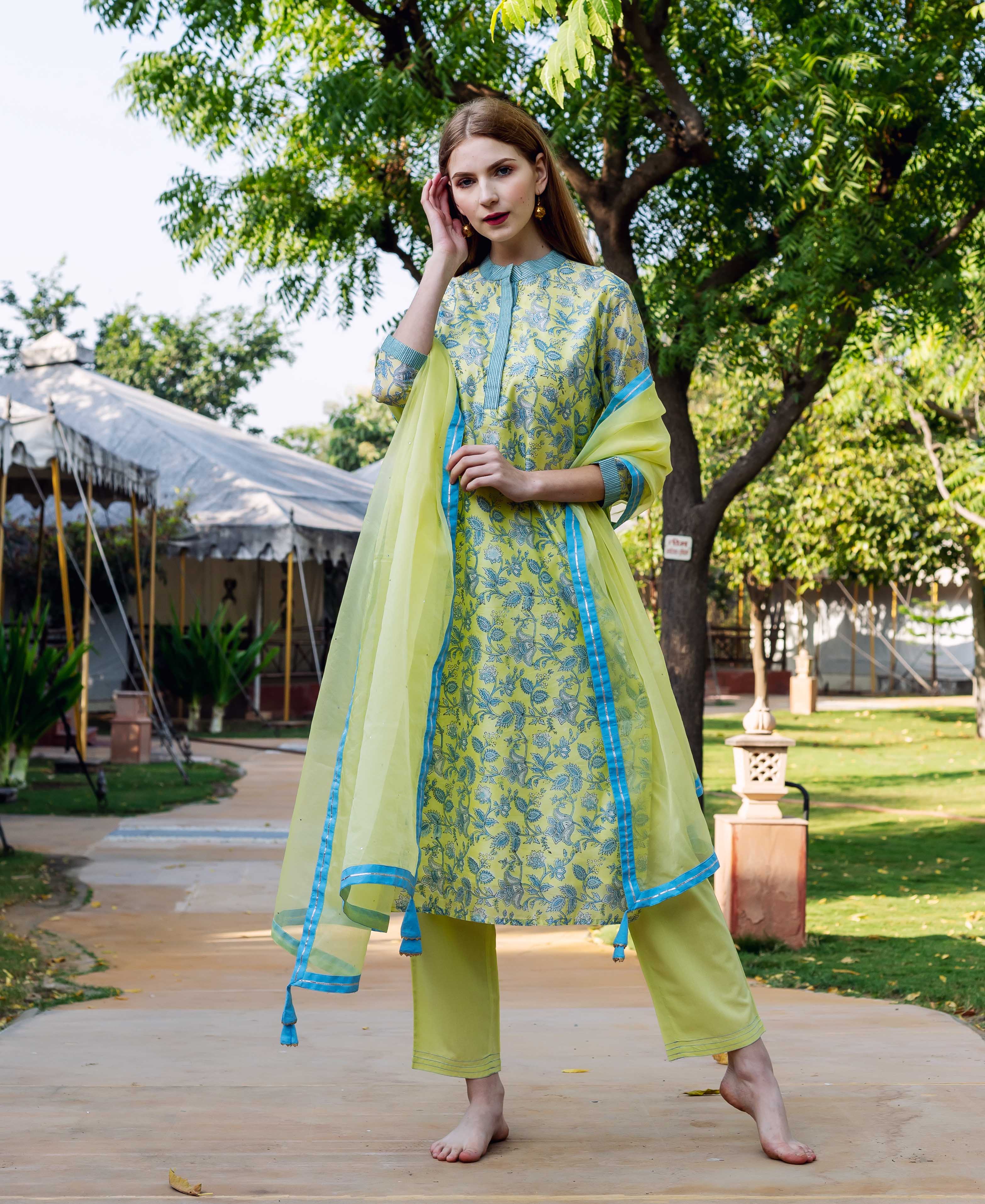 Lime green organza dupatta with blue accents and floral patterned tunic and pants.