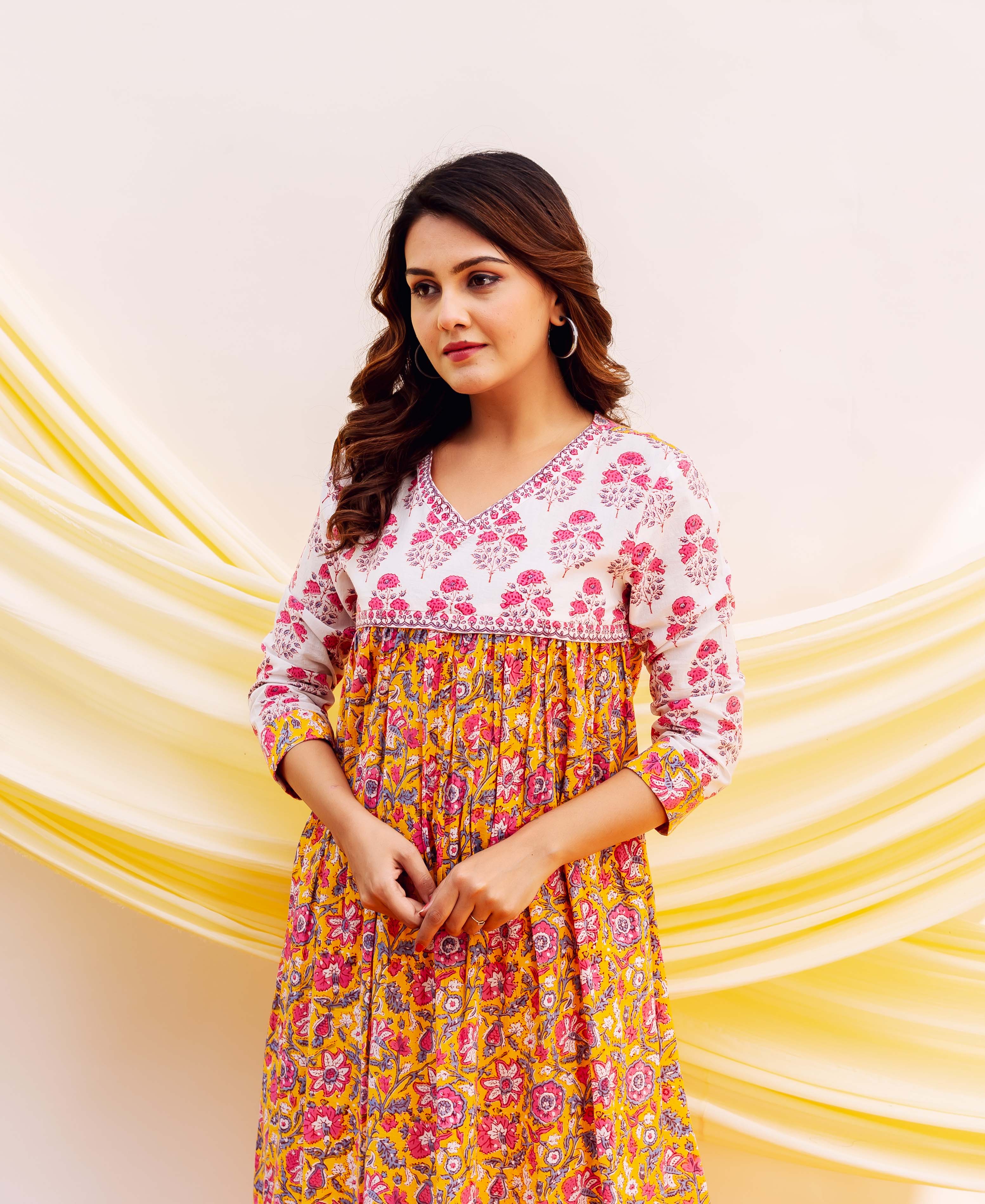 Front view model in a white, pink, and yellow floral hand-block printed cotton kurta.