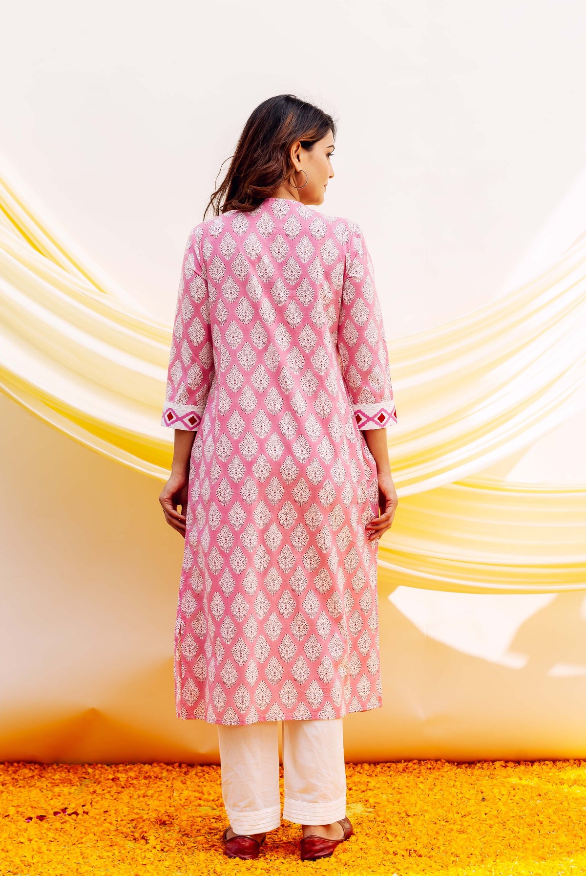 Pink and white hand-block-printed cotton kurta with white diamond-shaped patterns and trim.