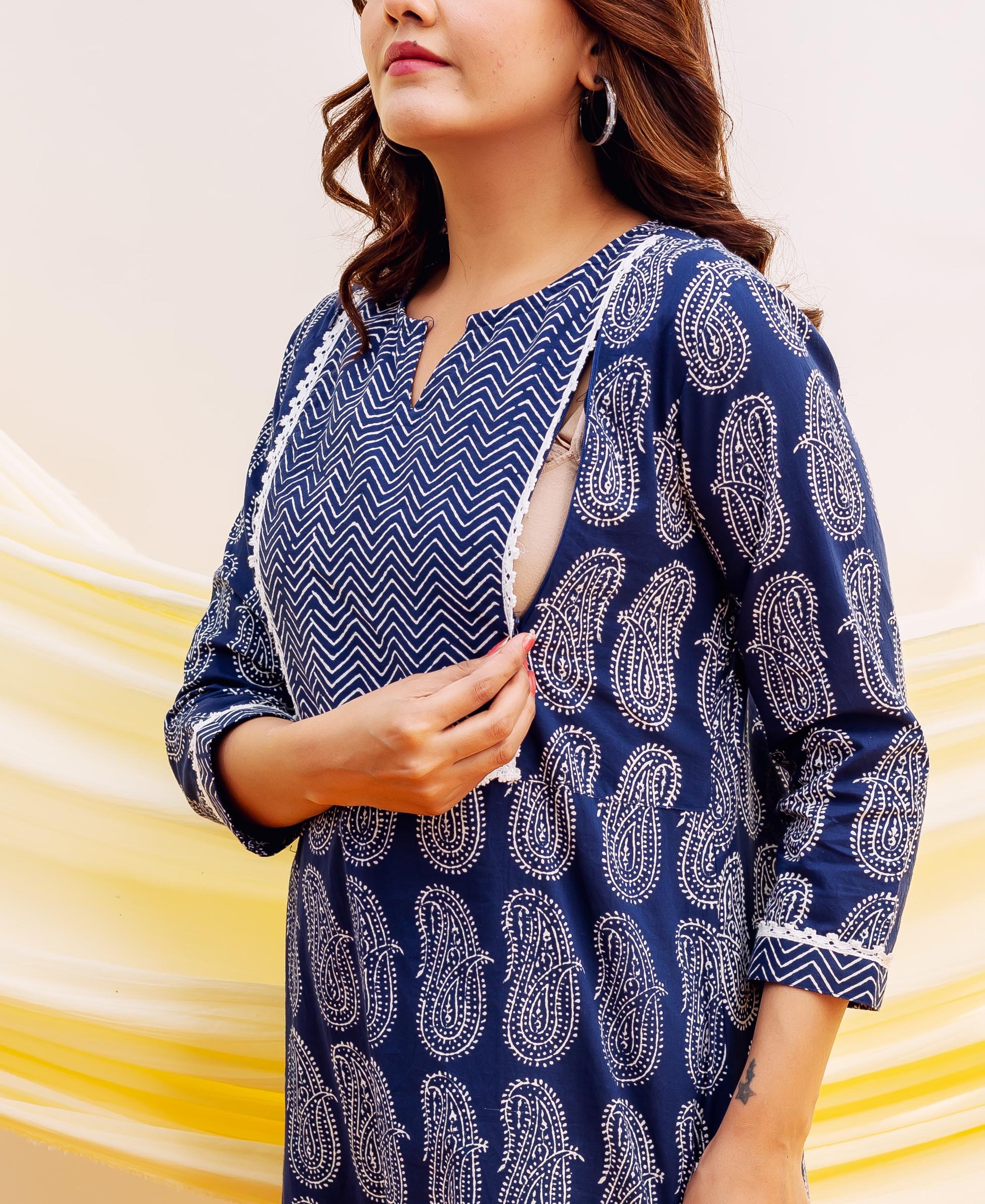 Model demonstrating nursing access of a navy blue cotton block printed kurta.