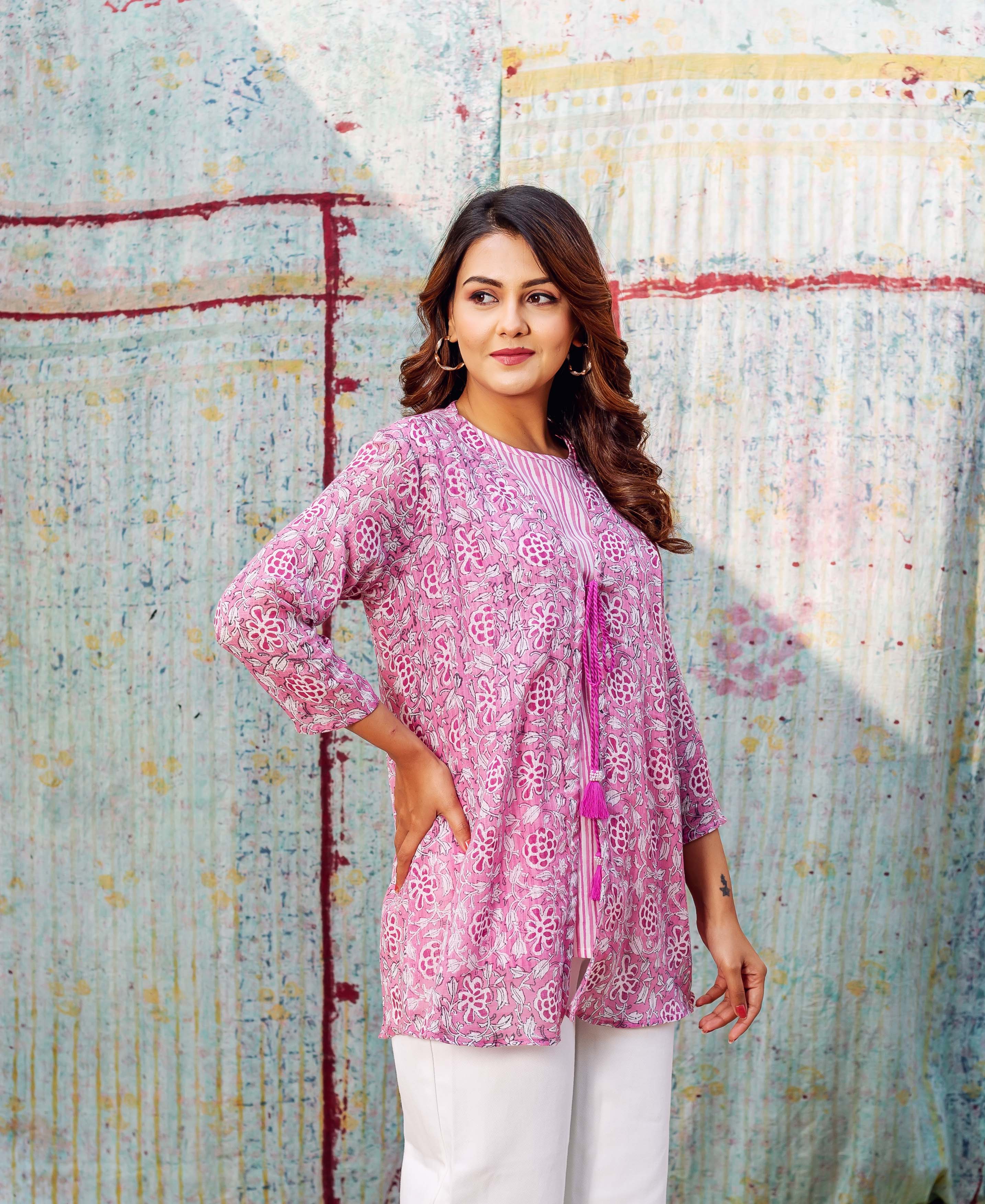 Blush pink hand-block printed floral layered cotton top on model, front view.