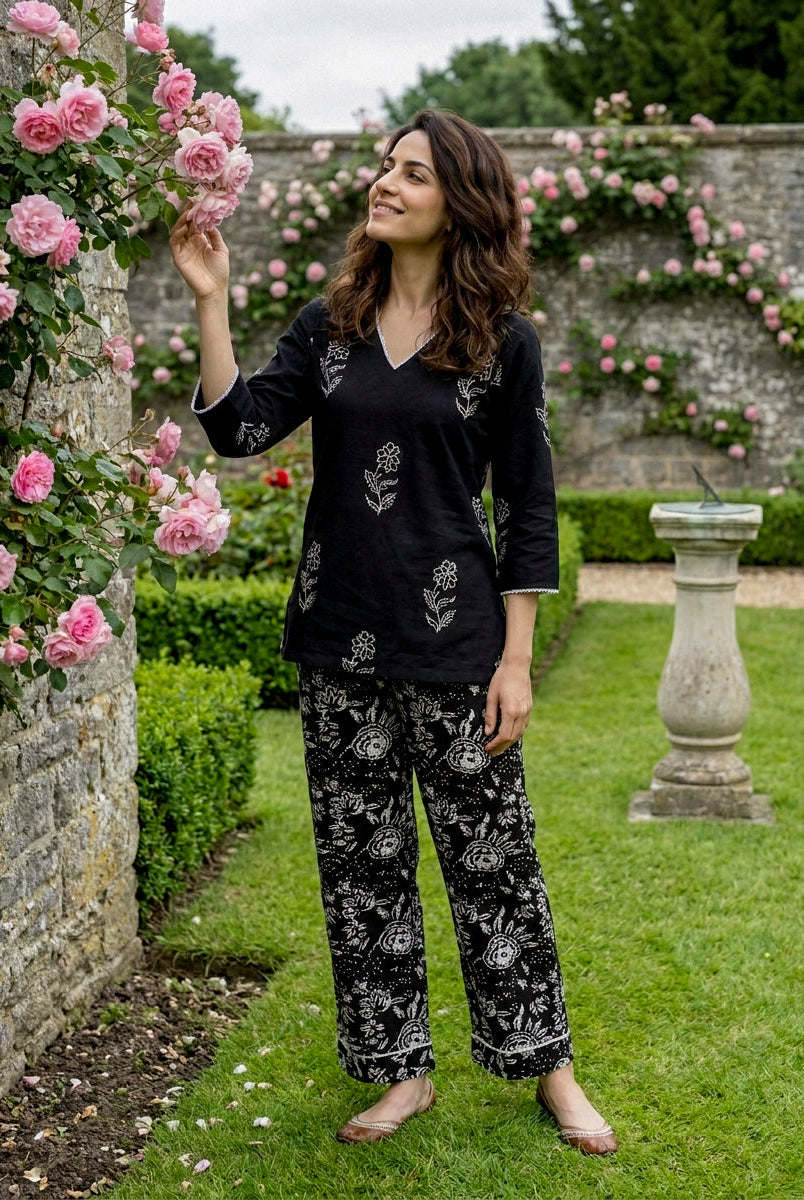 Model wearing black and ivory hand-block print floral cotton cord set.