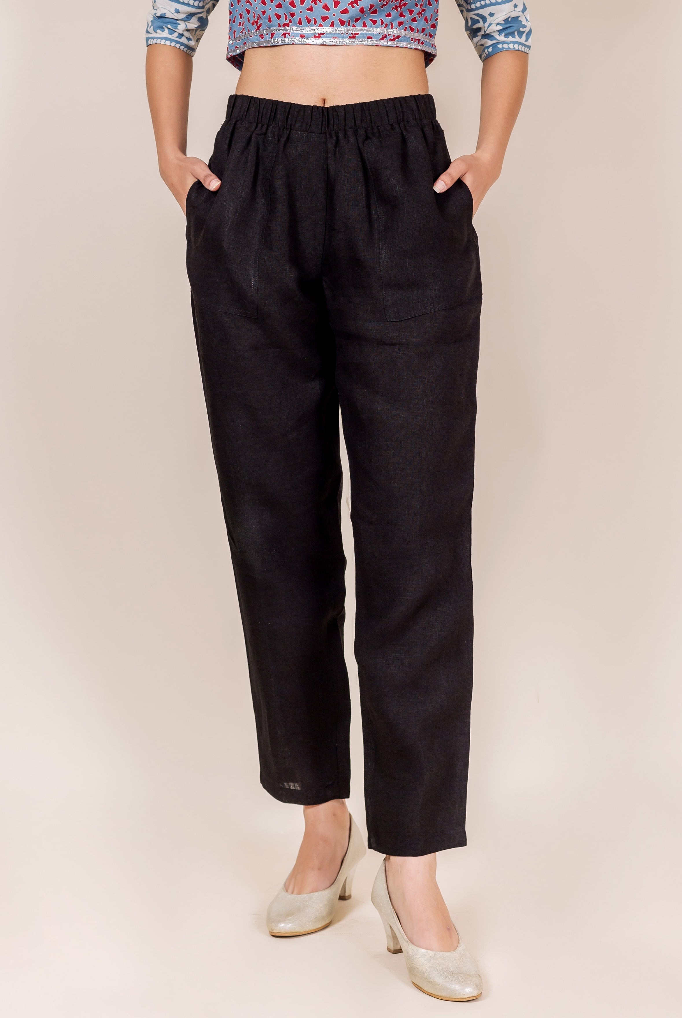 Front view of black linen pants with elastic waist and subtle hand-block-printed texture.