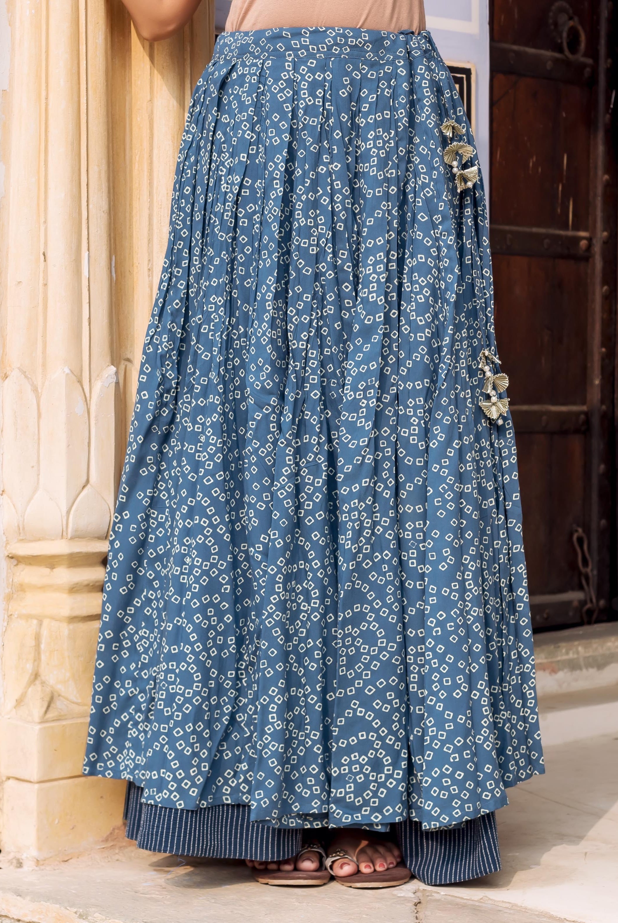 Full length indigo blue double-layered skirt with white square print and metallic floral side embellishments.
