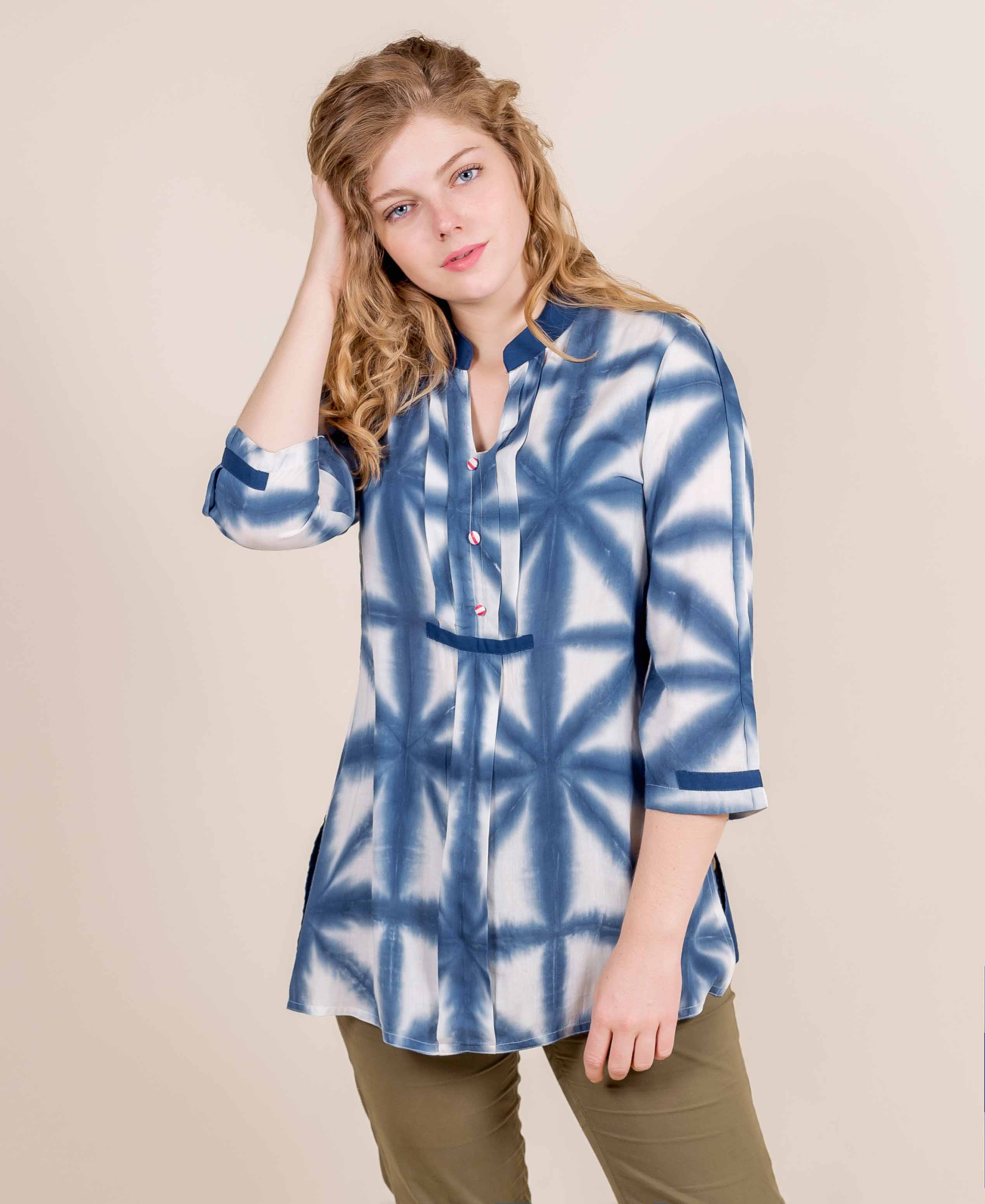 Model wearing blue and white tie-dye pleated mandarin collar short kurta top.