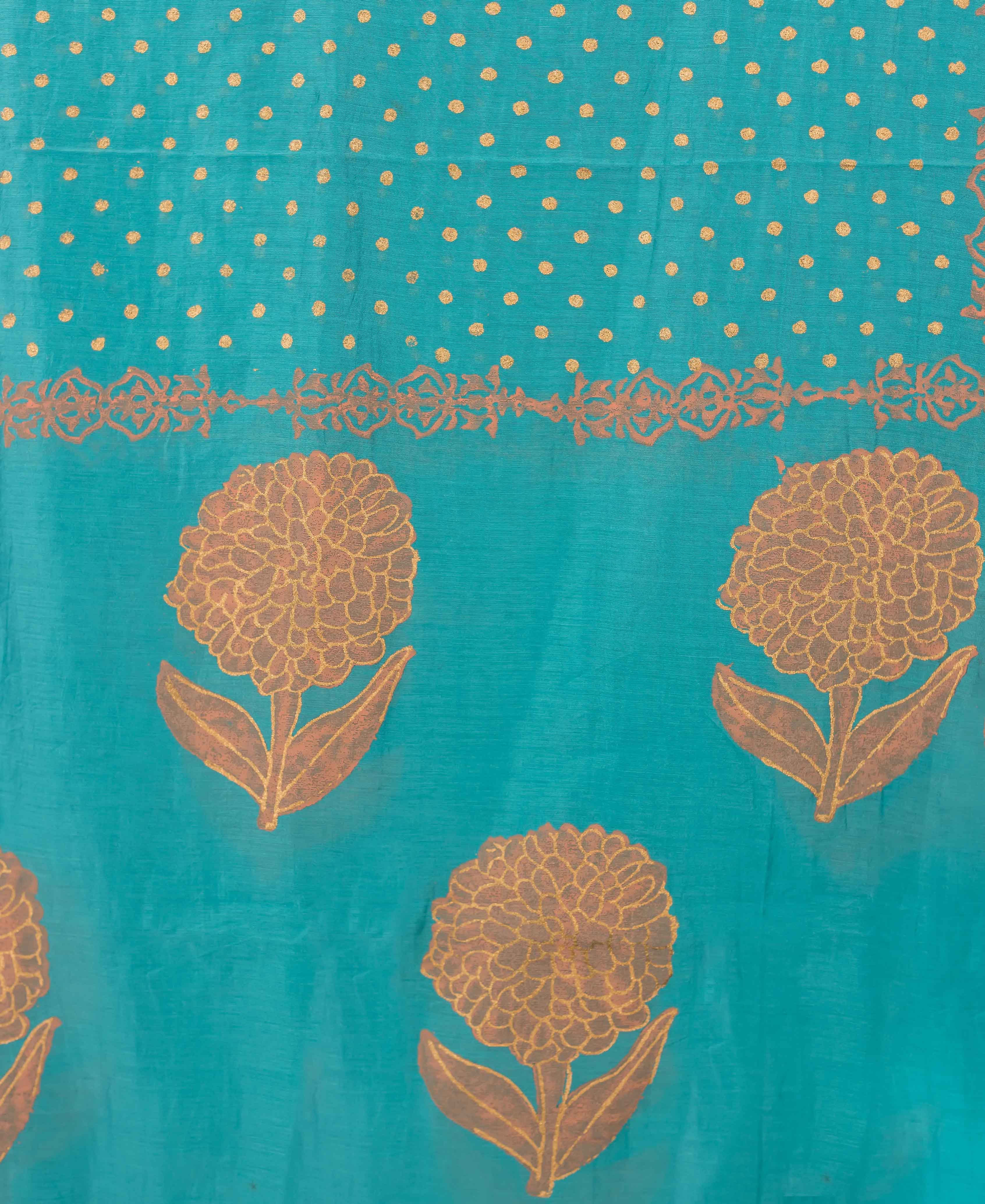 Turquoise dupatta with peach block print and polka dots.