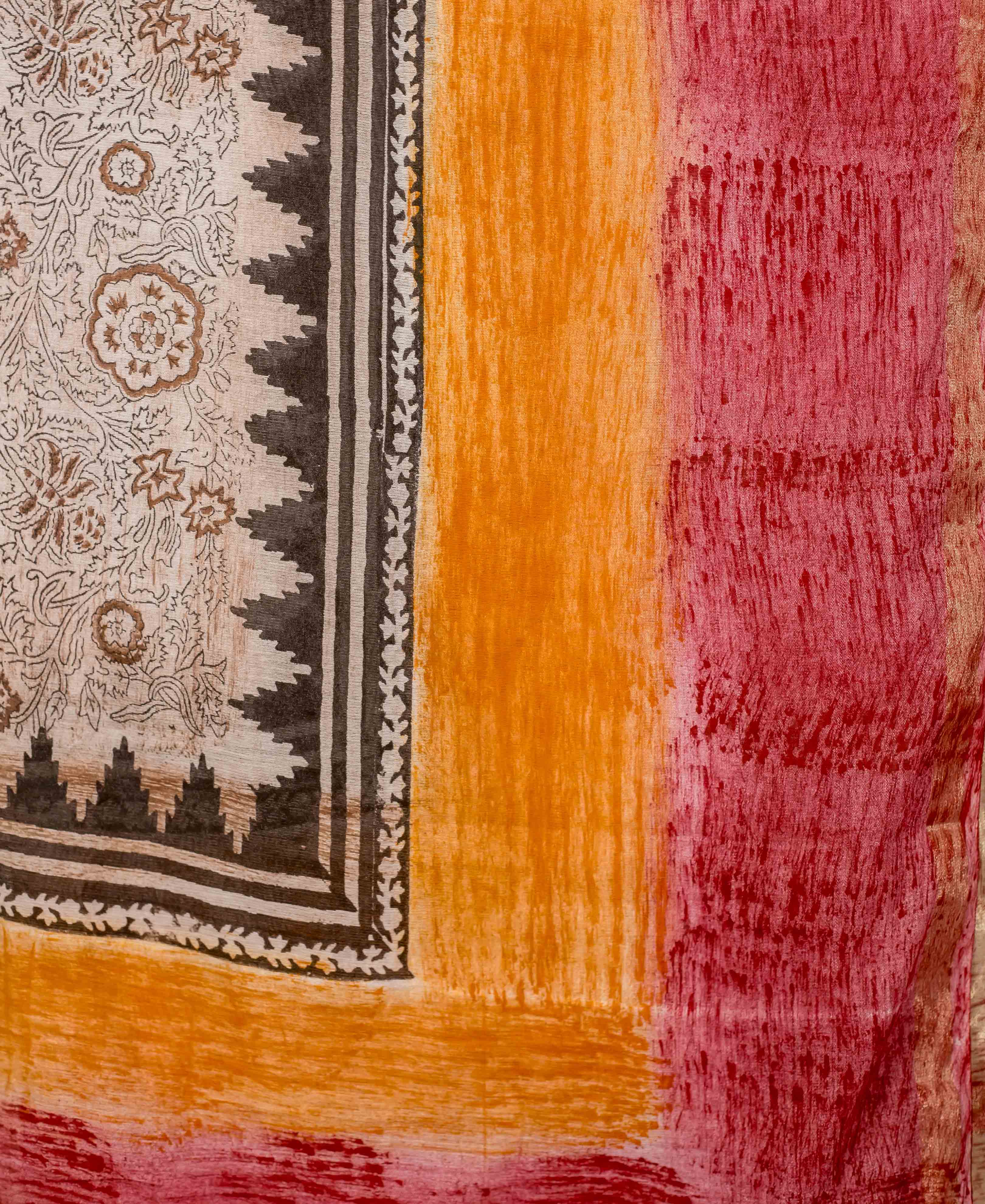 Draped red and orange hand-block printed dupatta featuring cream floral and ethnic patterns.