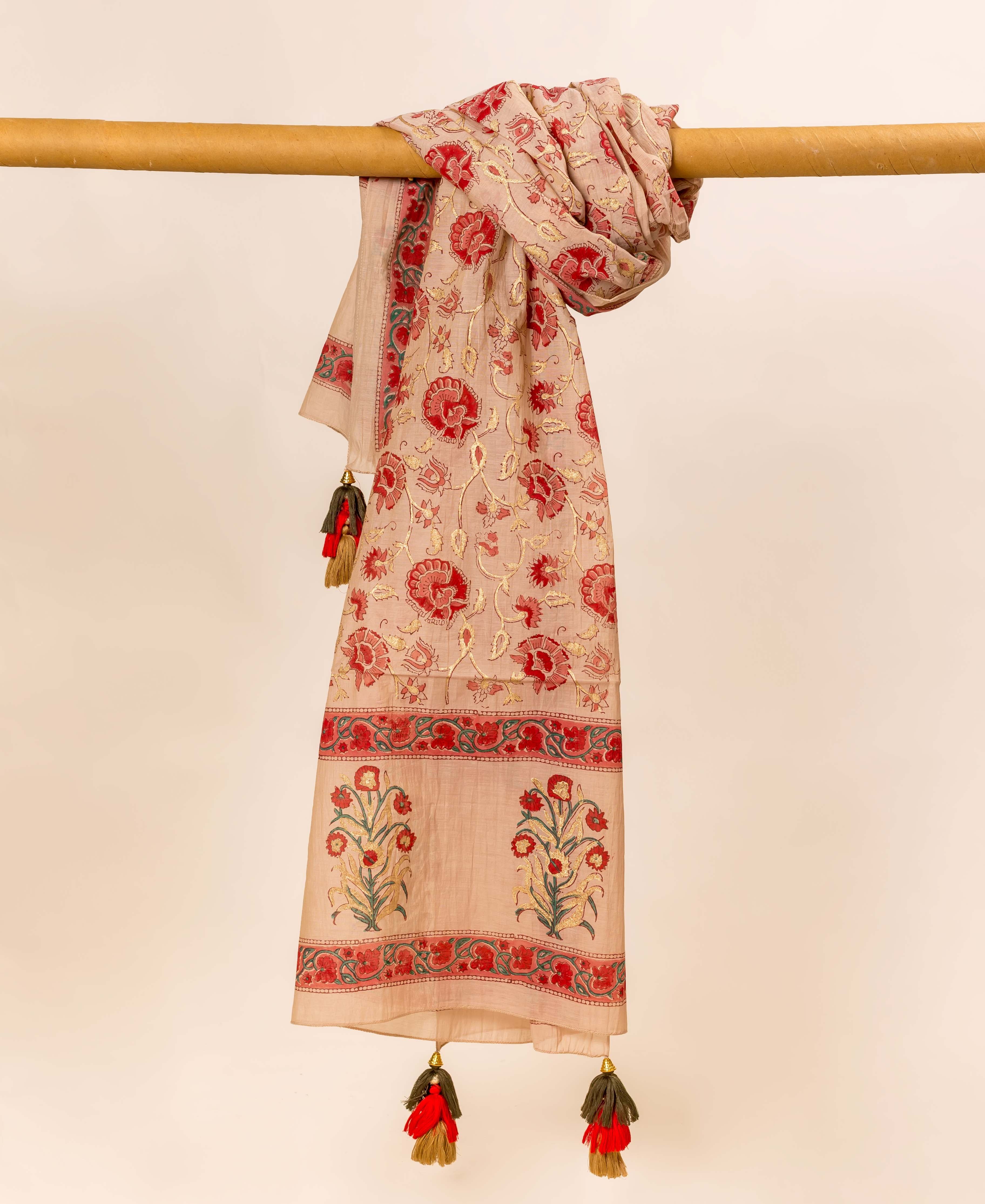 Beige hand block printed dupatta, full view, with red and gold floral print and tassels.