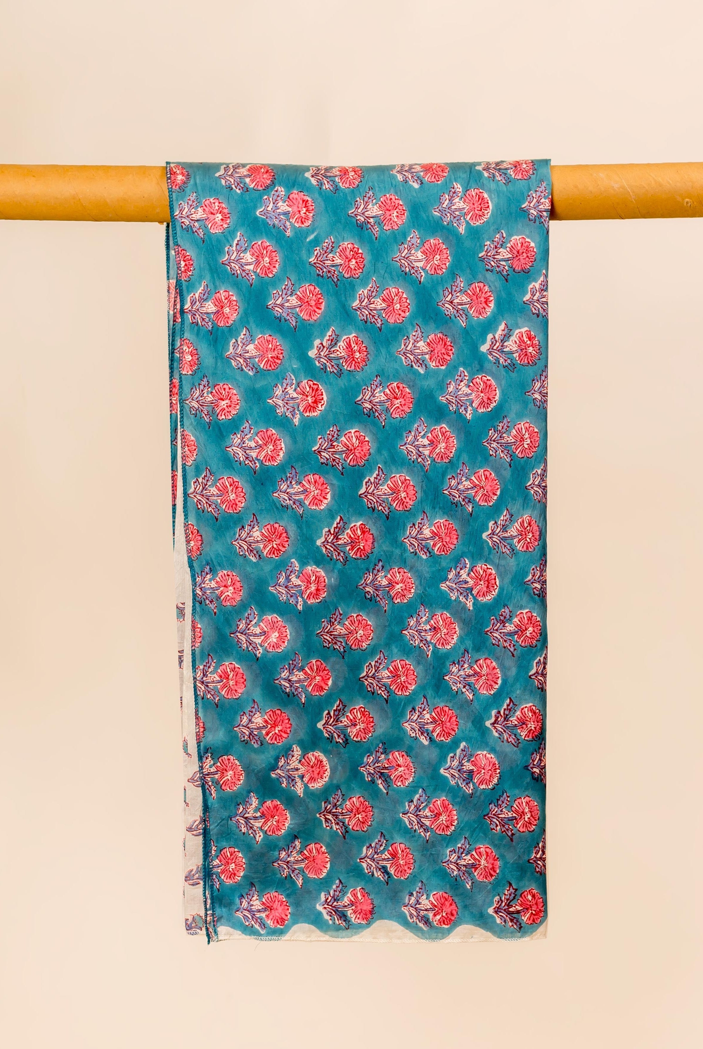Teal blue hand block printed chanderi dupatta with red floral pattern.