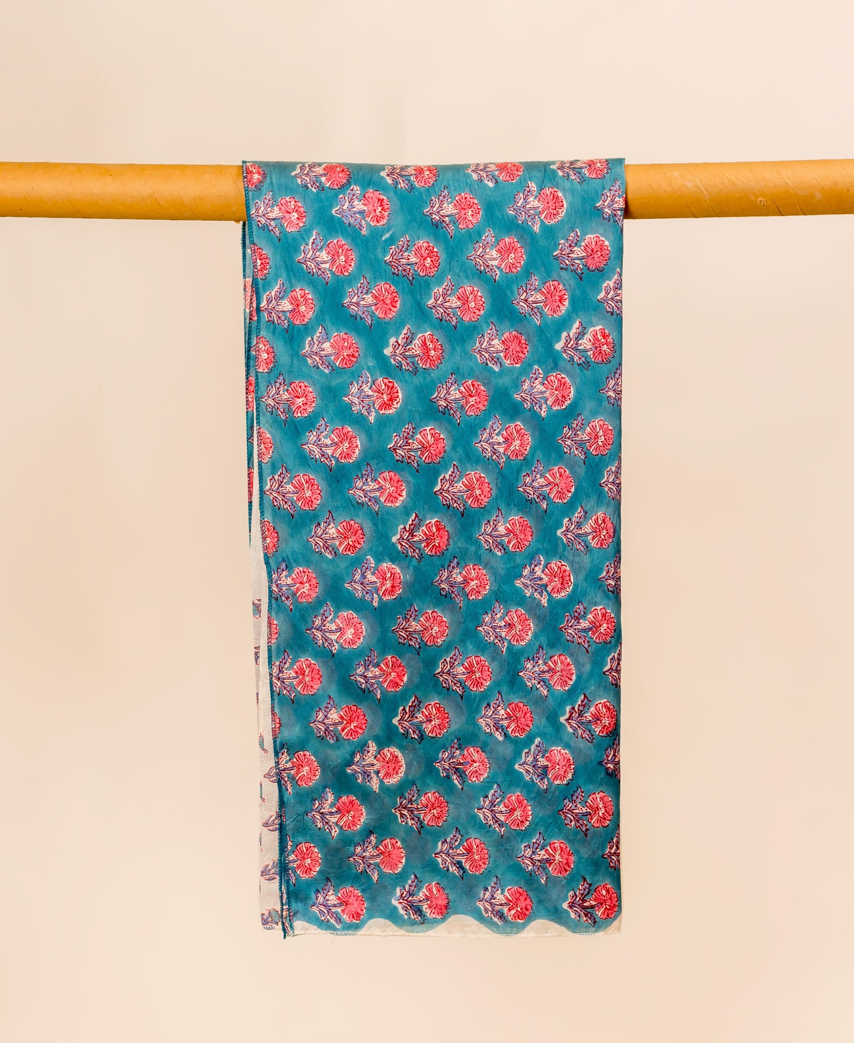 Teal blue hand block printed chanderi dupatta with red floral pattern.