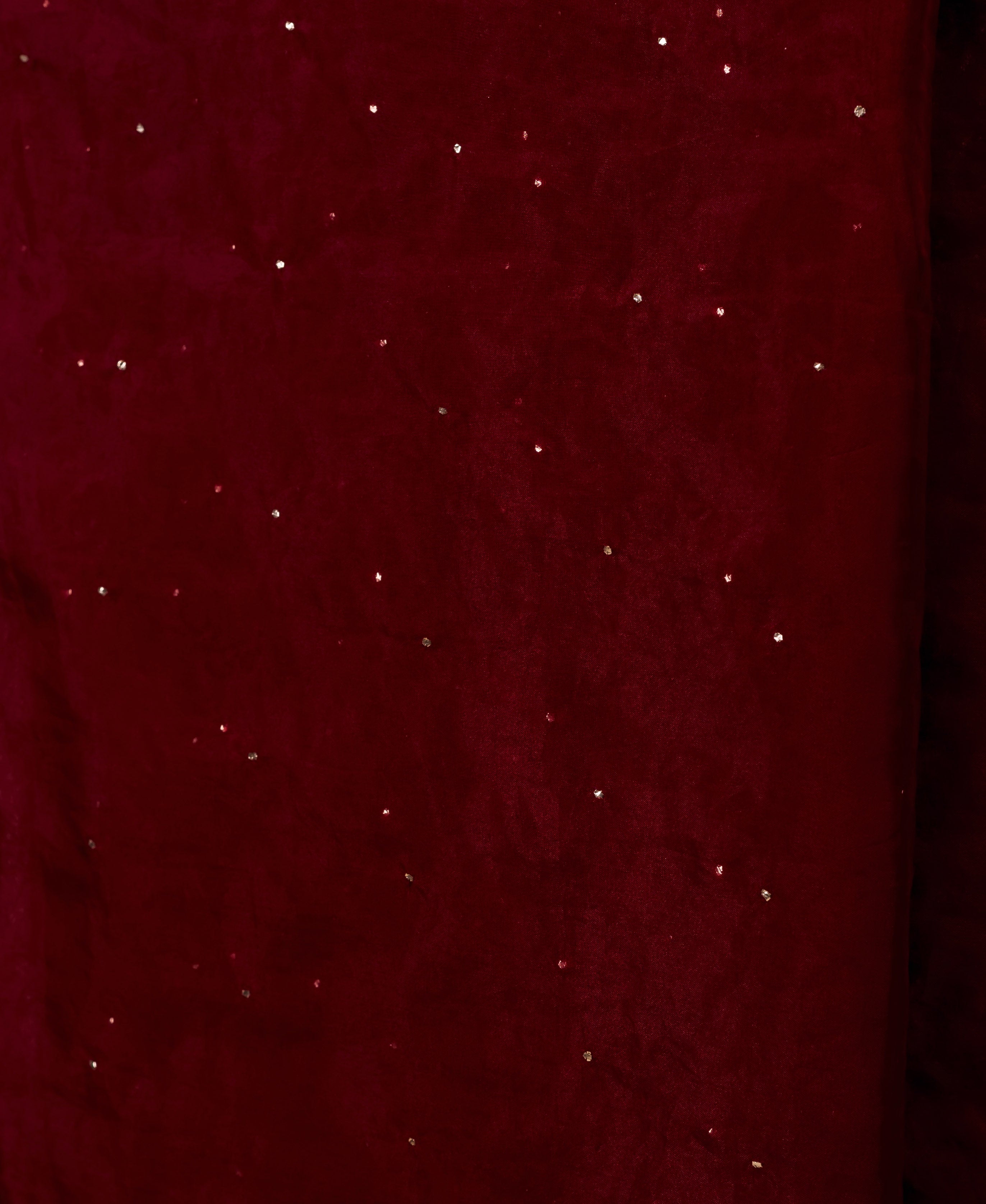 Draped maroon organza dupatta featuring scattered shimmering metallic mukaish dots.
