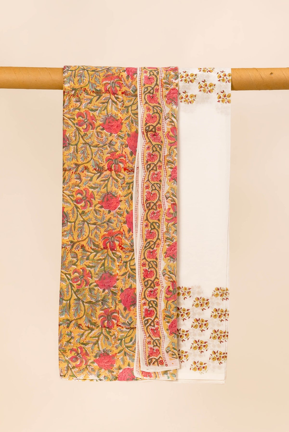 Vibrant yellow and white hand-block-printed dupatta with pink, orange, green floral motifs and borders.