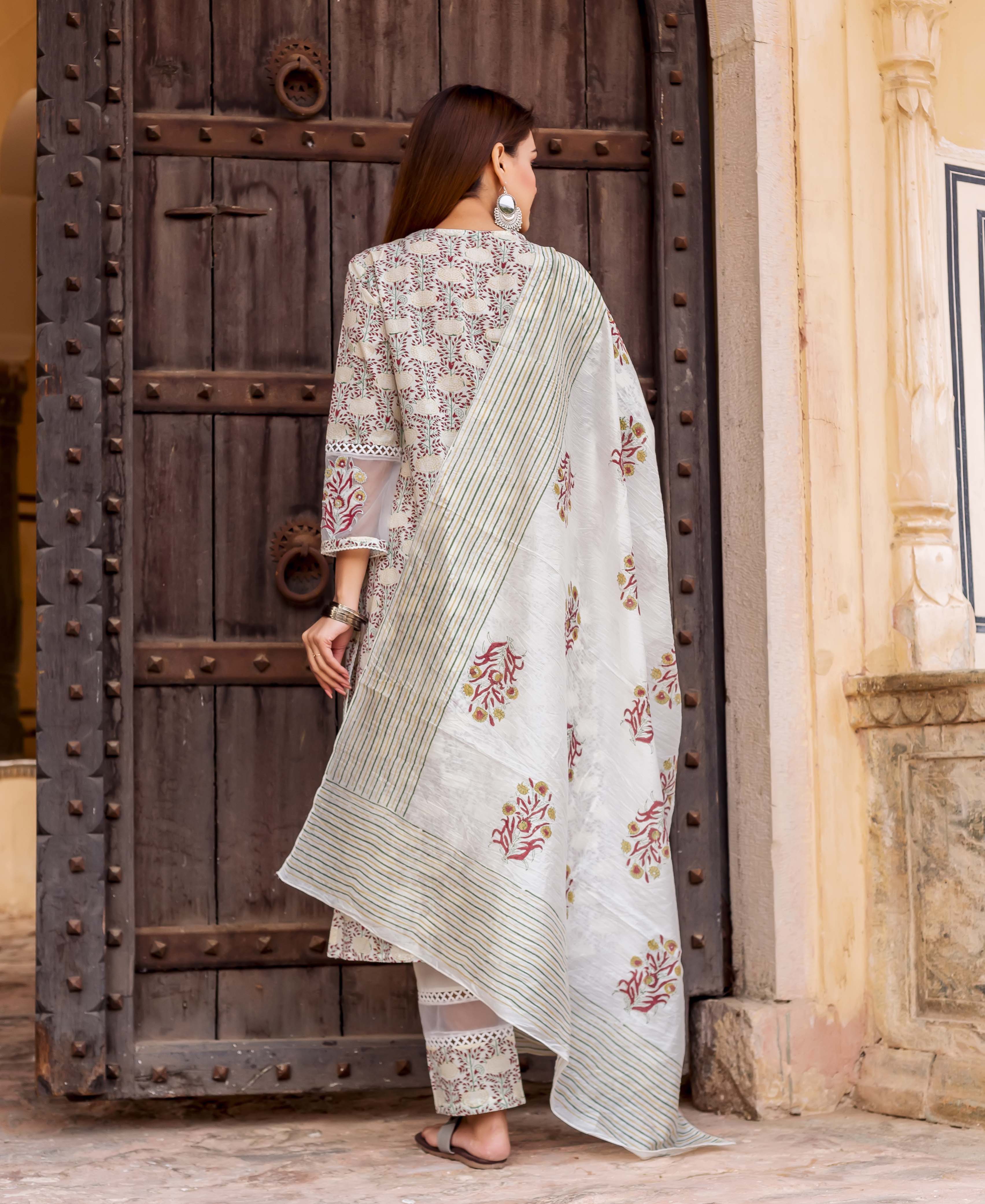 White hand block printed dupatta with red flowers and green stripes on model, back view.