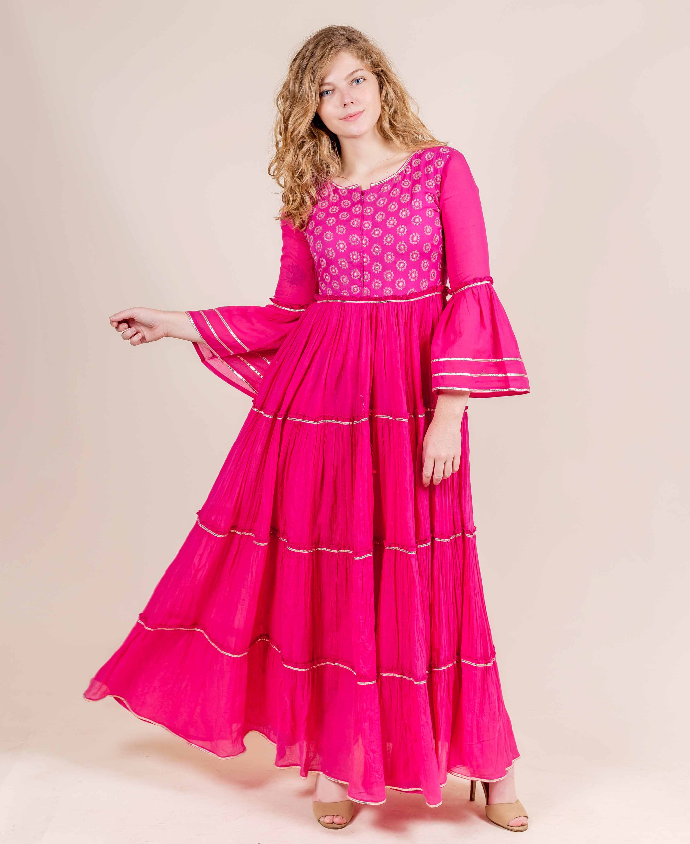 Full look fuchsia tiered cotton dress, hand-block-printed yoke, full bell sleeves with gota trim.