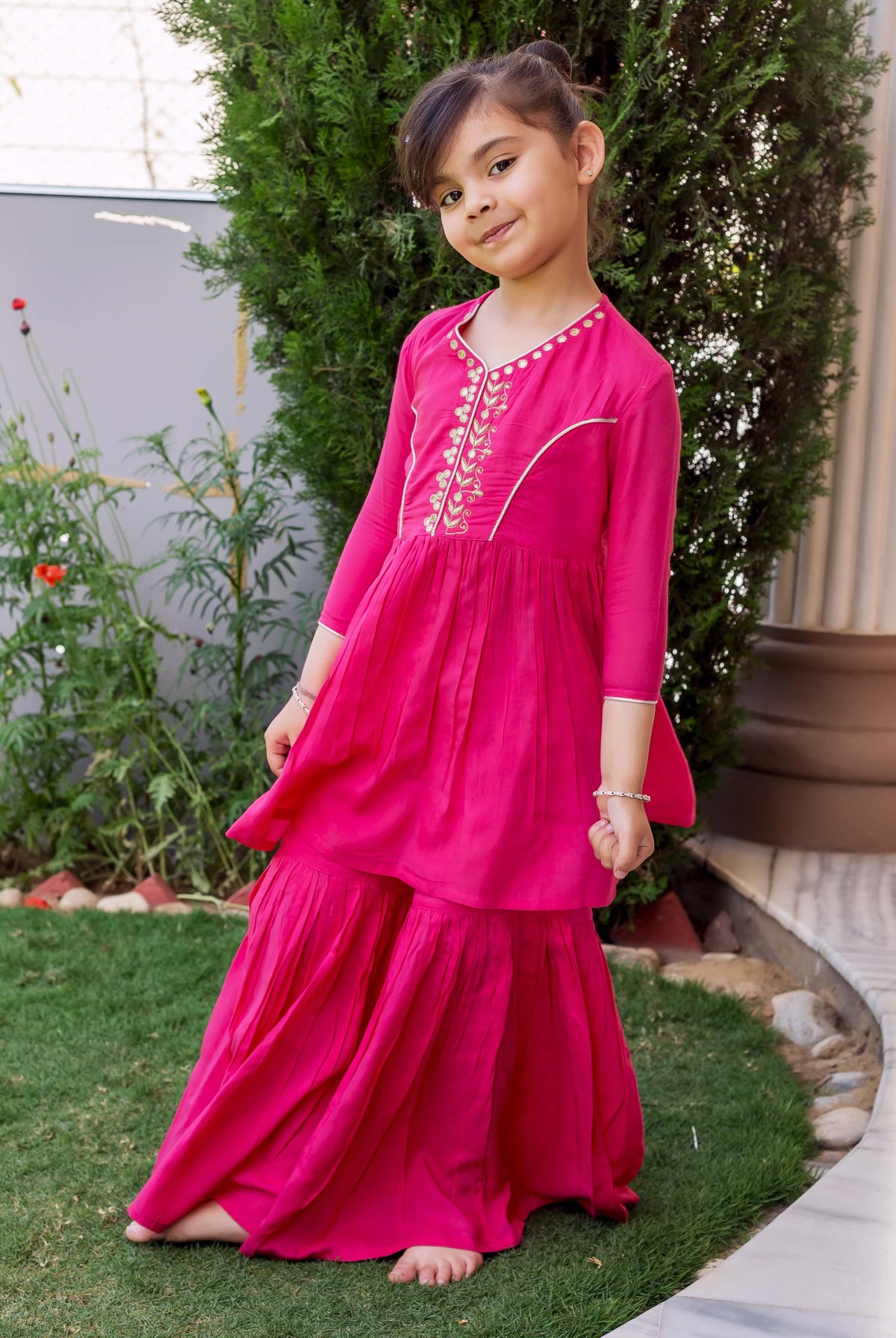 French Rose hand embroidered sharara set on young girl, standing full length.