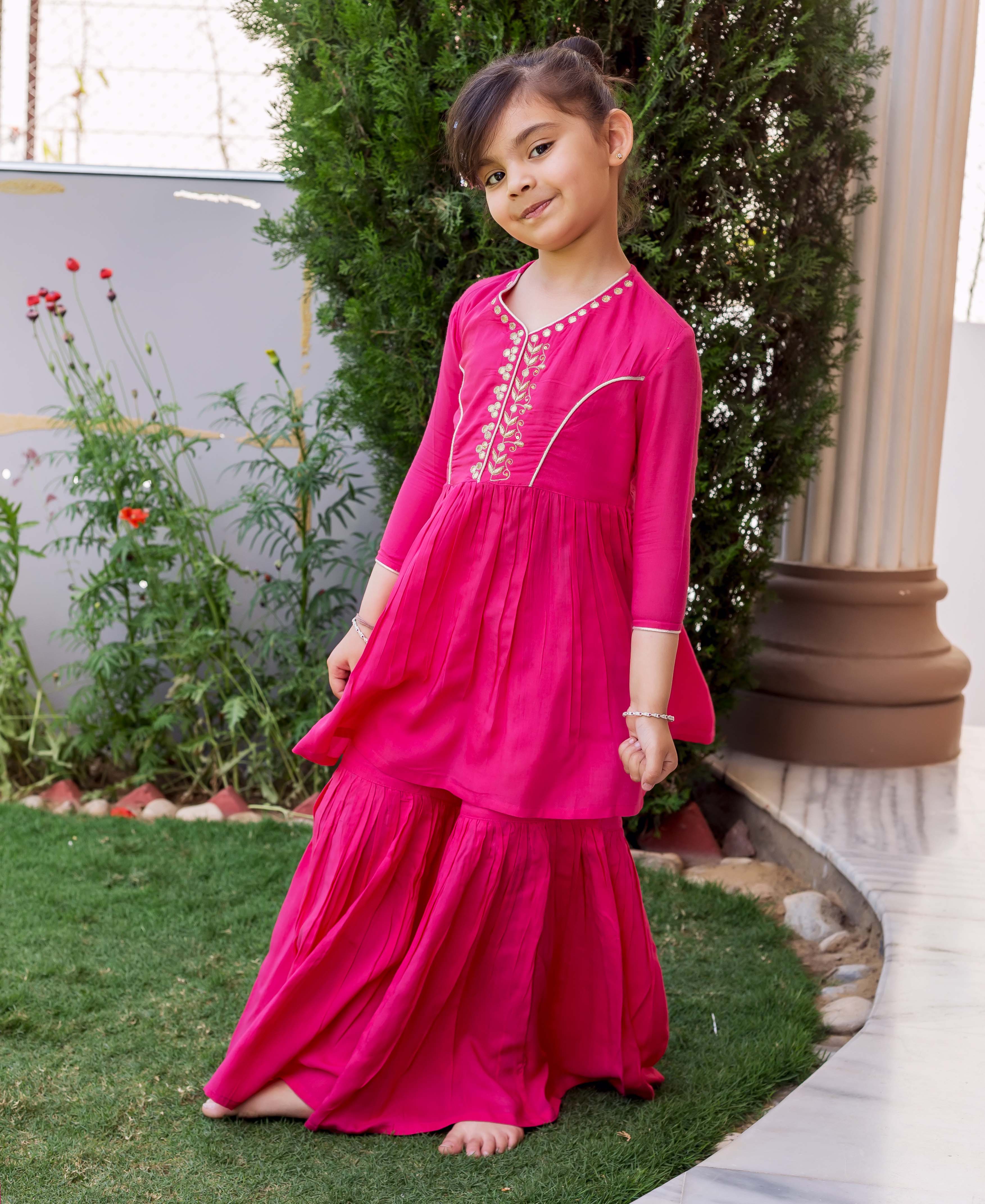 French Rose hand embroidered sharara set on young girl, standing full length.