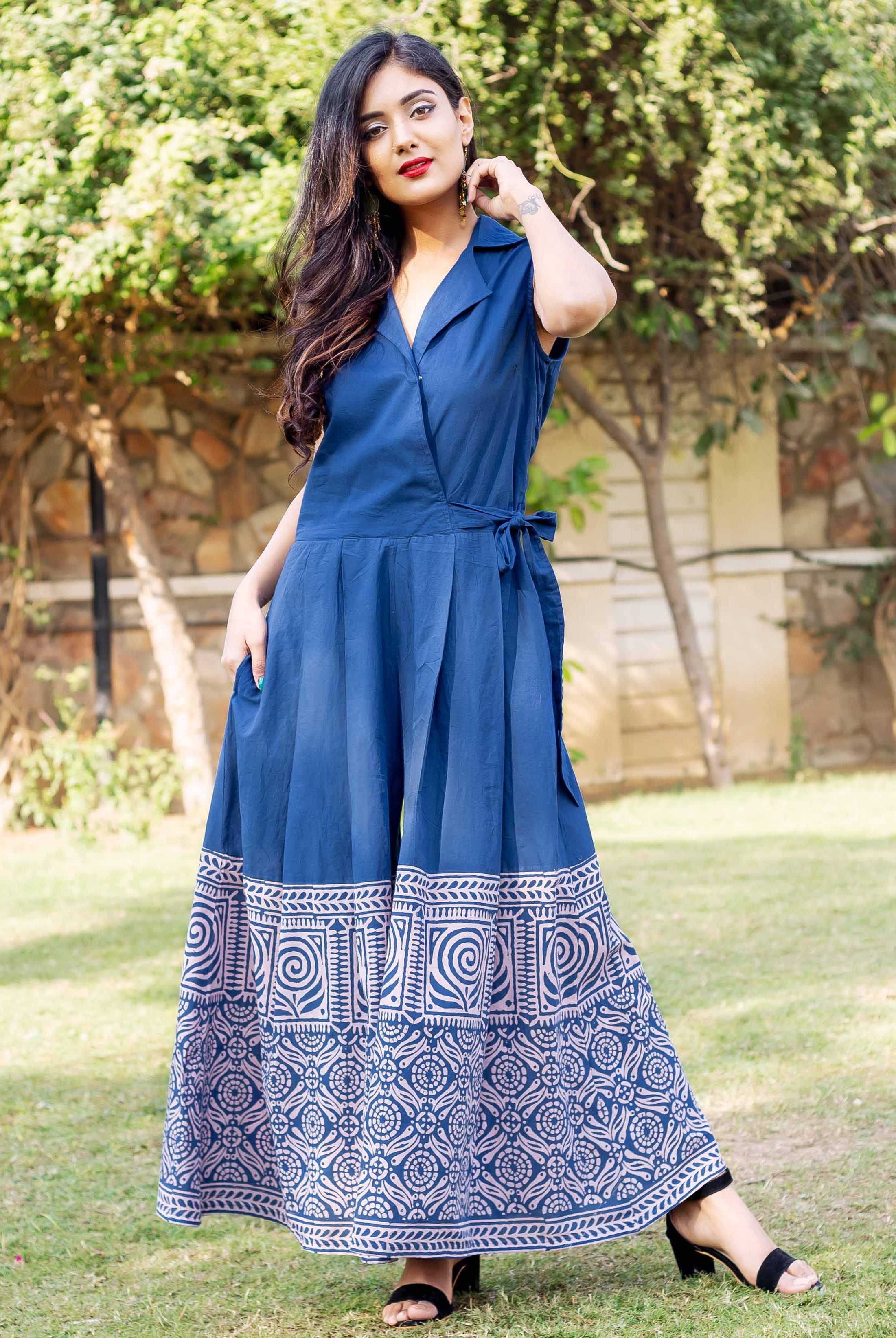 A woman in a blue and white hand-block-printed cotton jumpsuit.