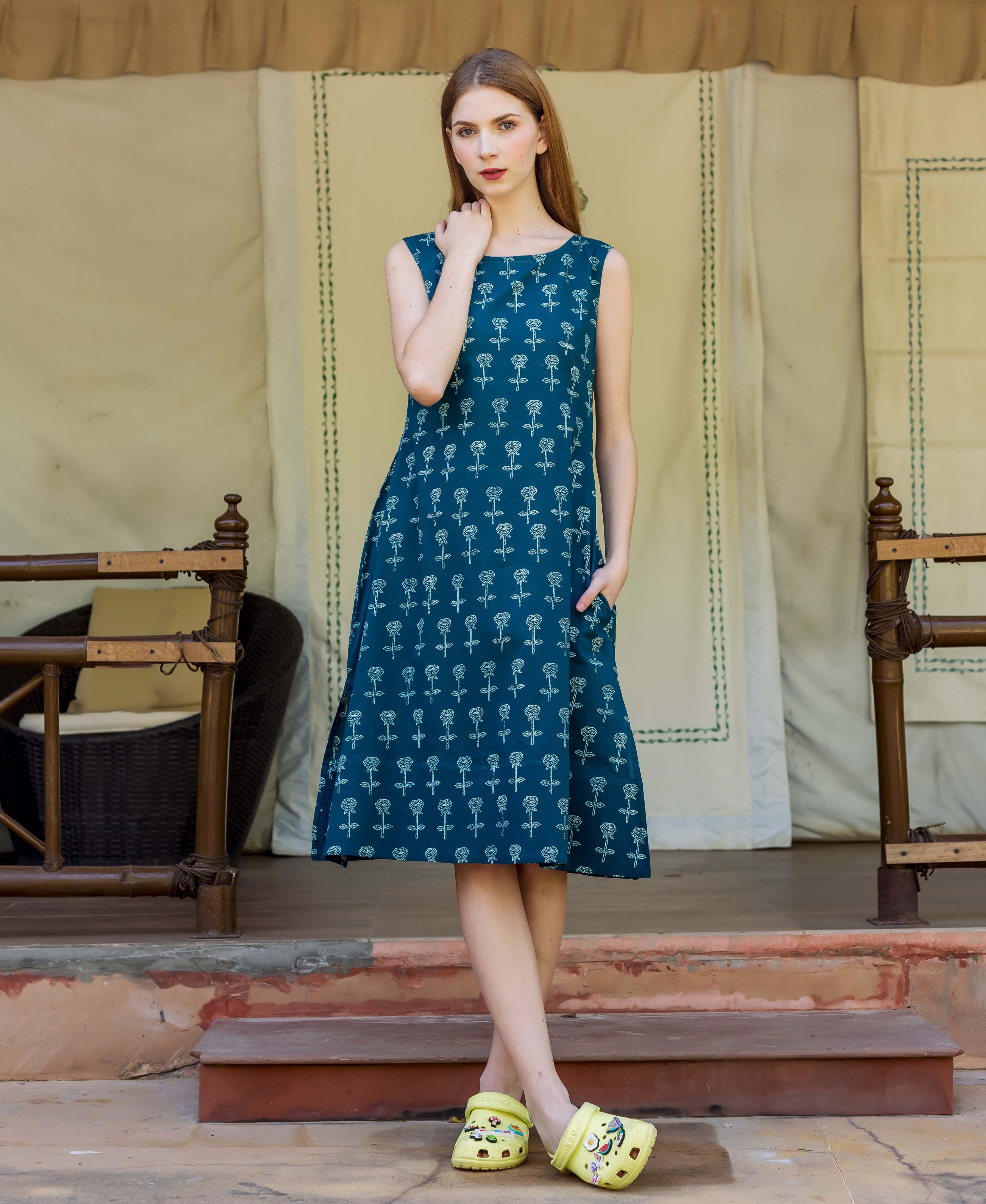 Front view model in full-look teal A-line dress with white hand-block floral print.