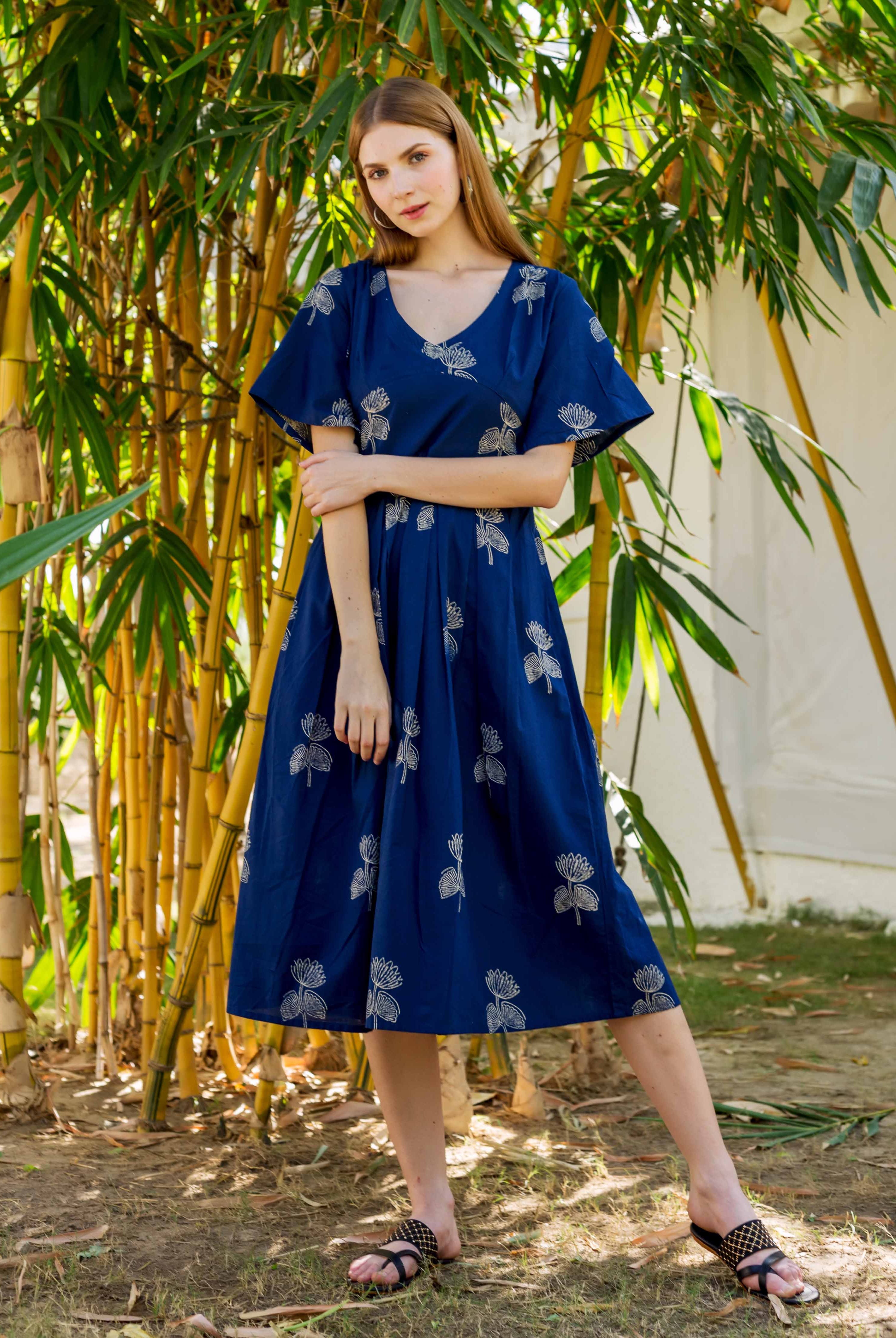 Front-facing model wearing a full-look indigo blue dress with white floral hand-block print.