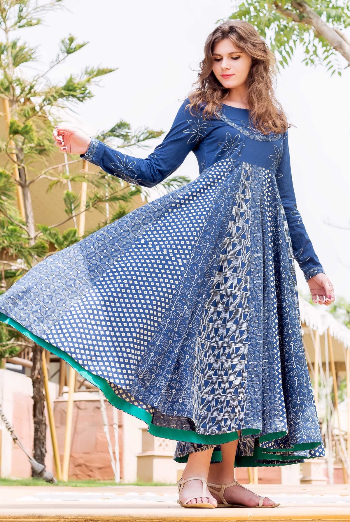 Front full look of model in indigo and white hand block printed flared long dress.