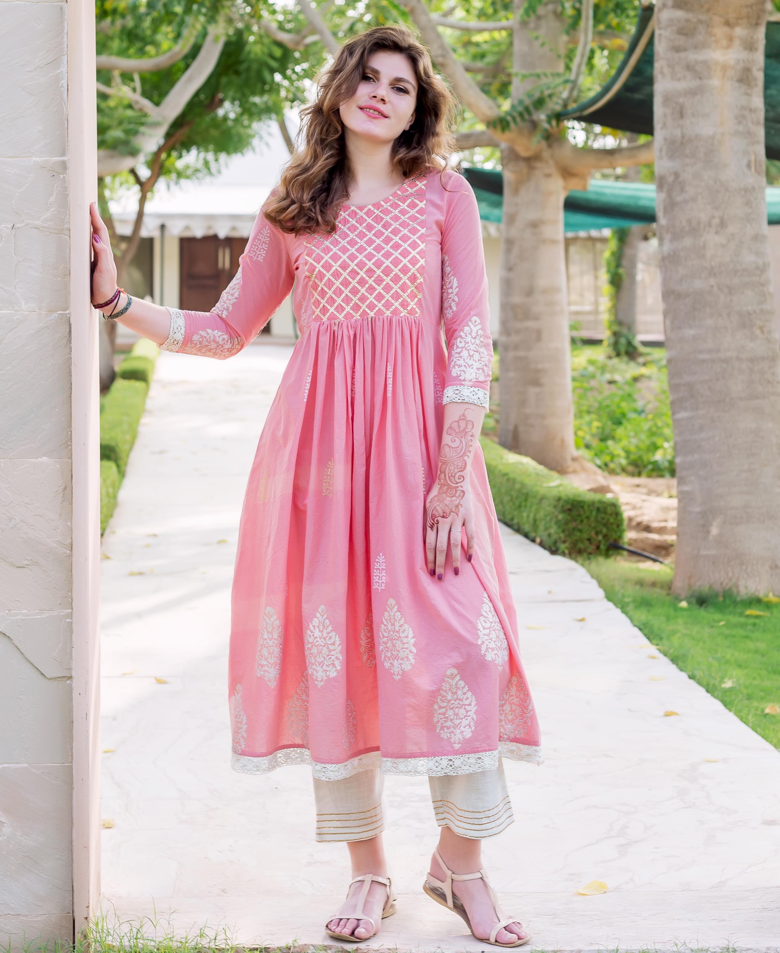 Front full-length model in pink hand-block-printed ethnic A-line kurta and light pants.