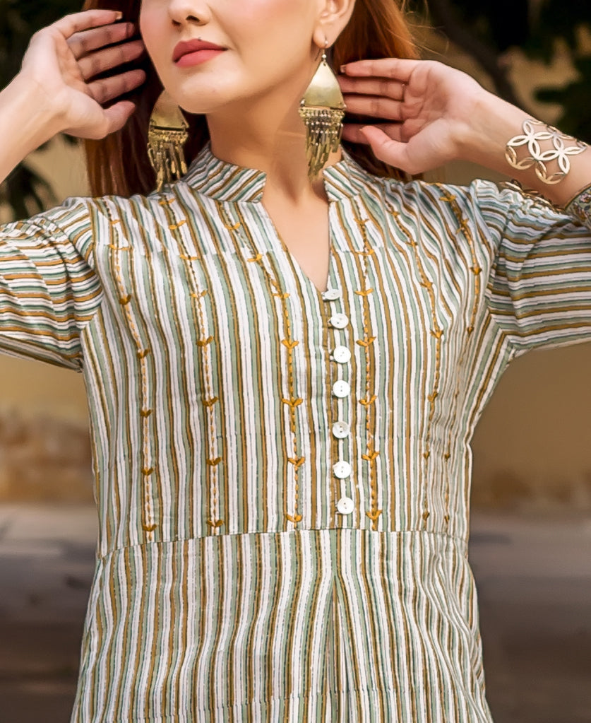Front view of a model wearing an olive green, brown, and white striped embroidered kurta.