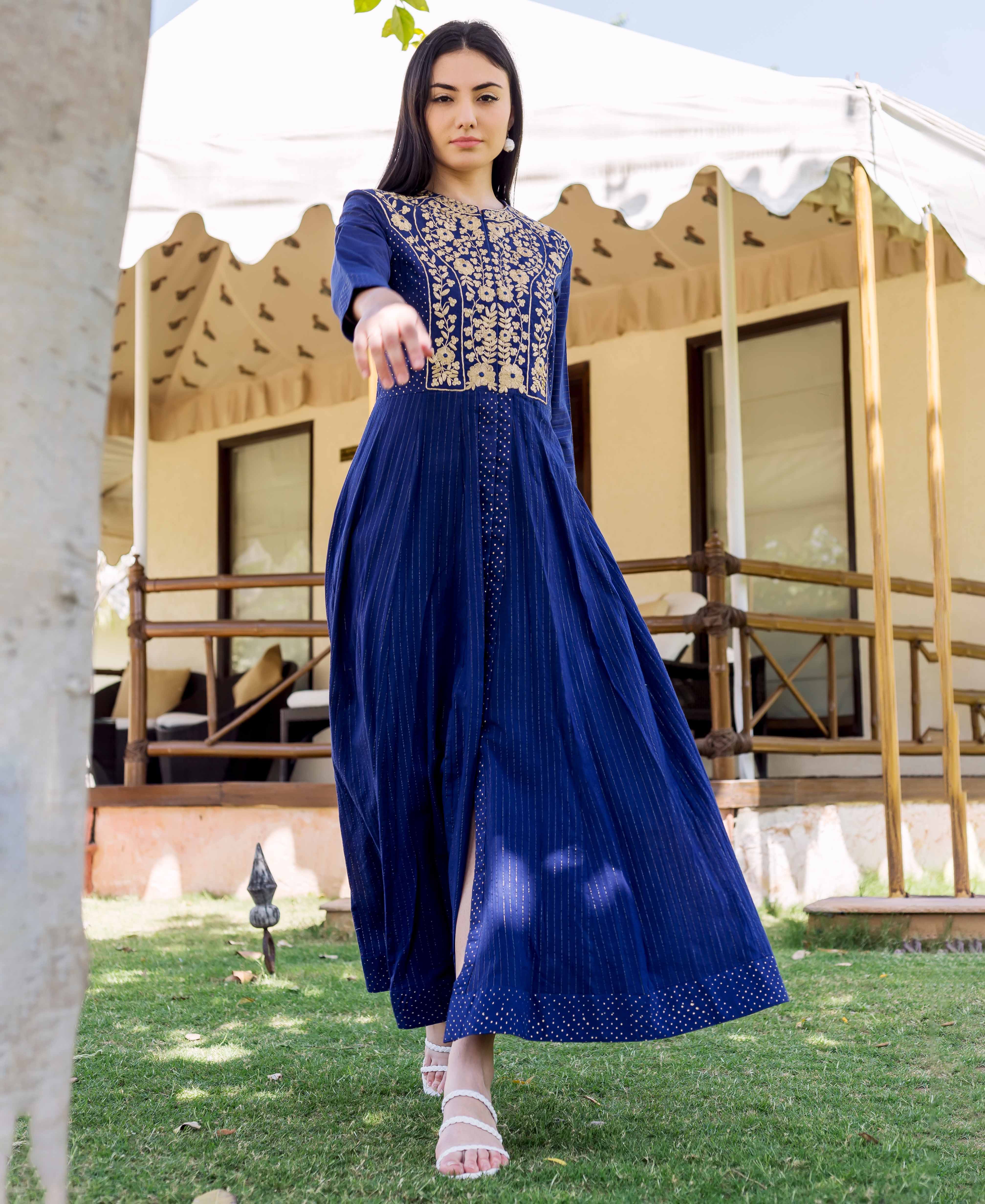 Front view model in royal blue hand-block-printed dress with gold embroidery and prints.