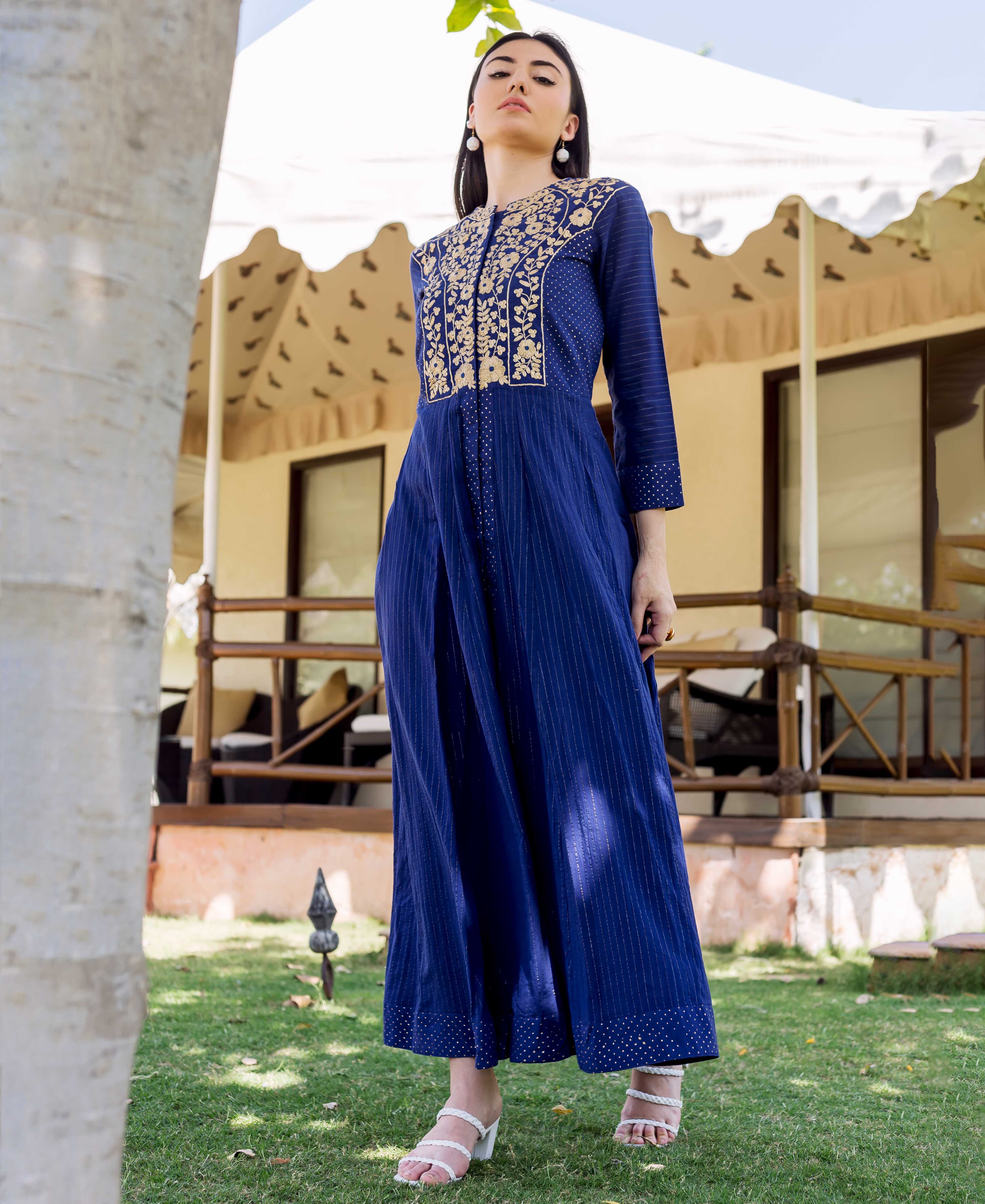 Front full look of a model in a royal blue embroidered and printed ethnic dress.