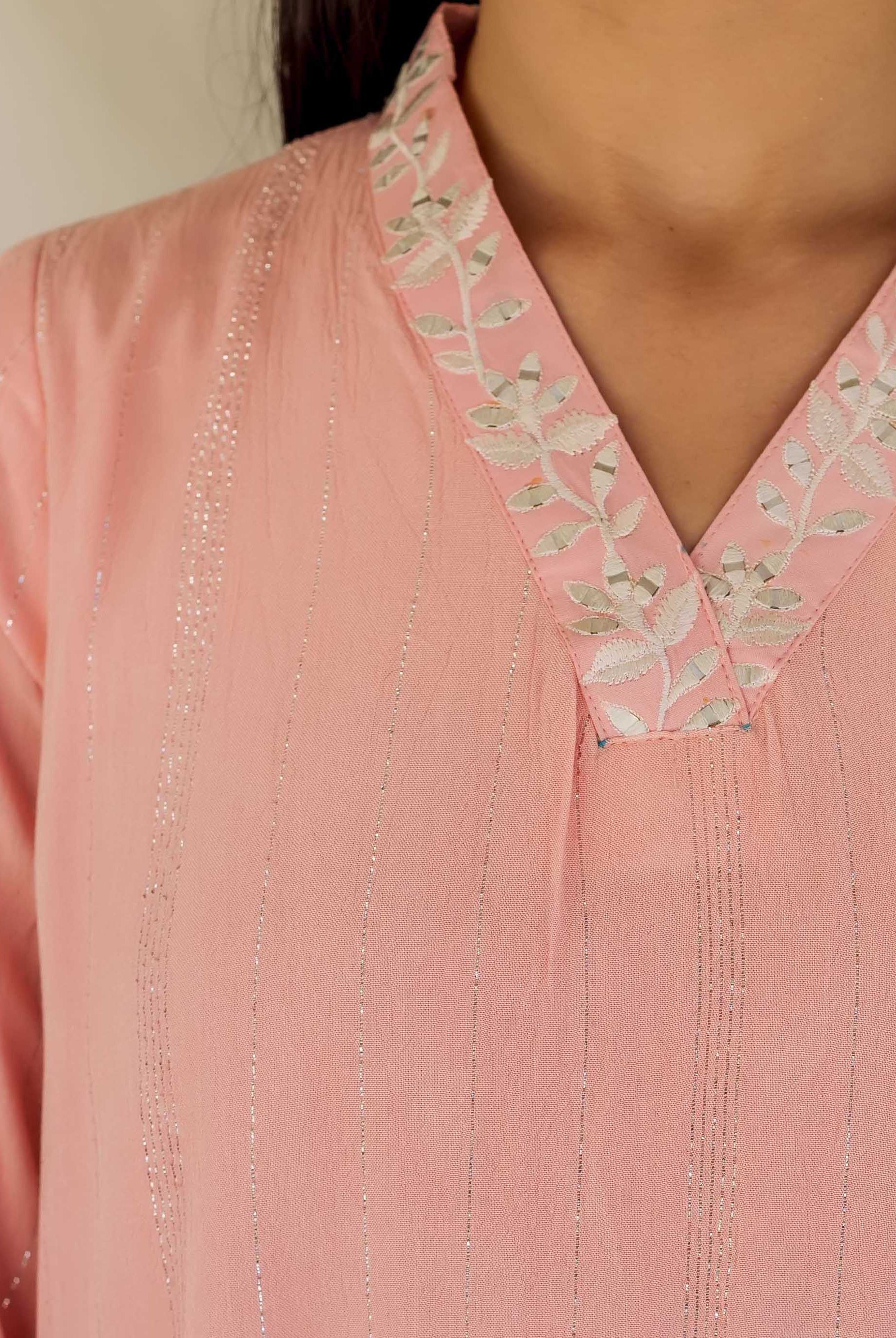 Front torso view of pink kurta with silver leaf embroidery on yoke and striped pattern.