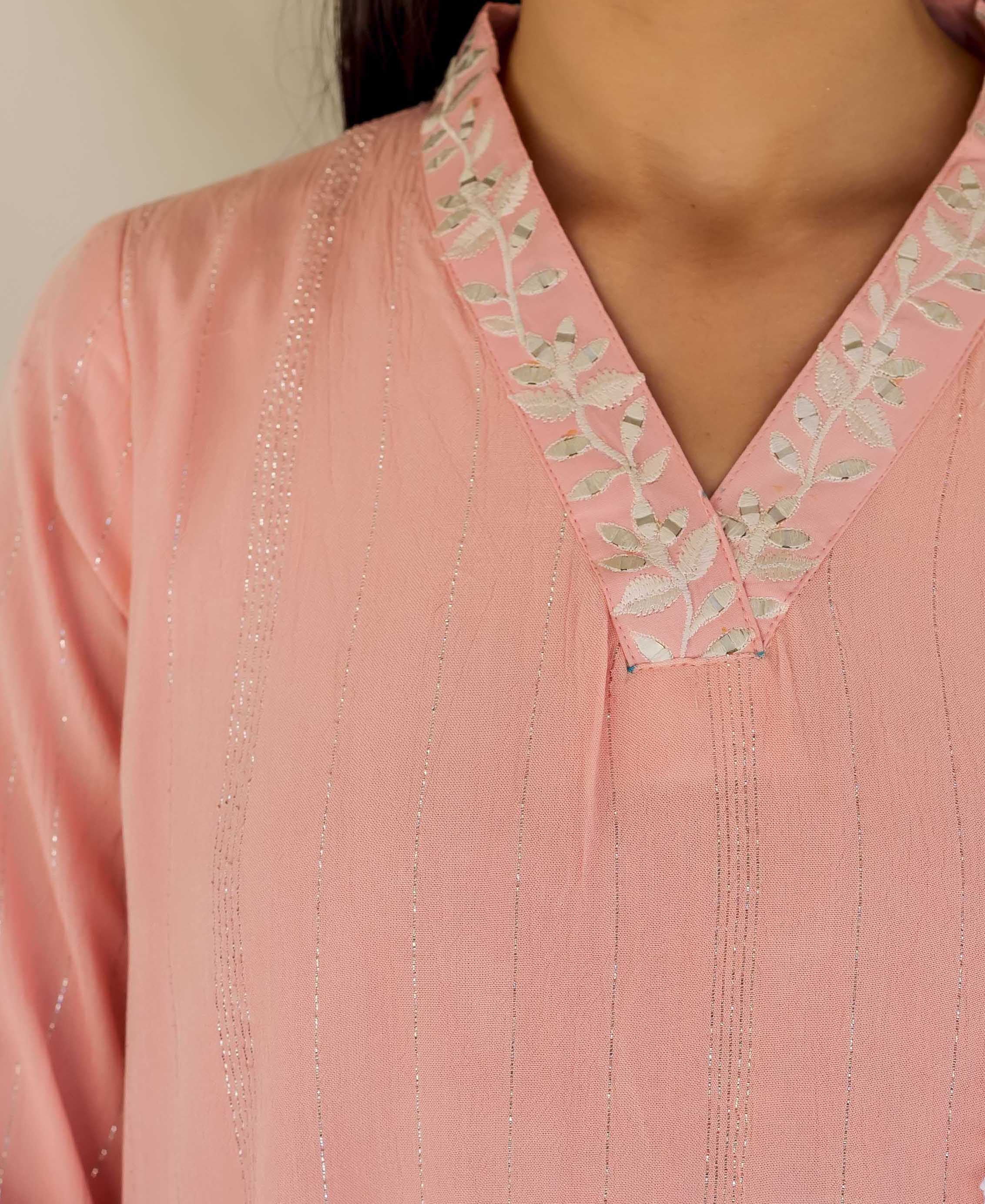 Front torso view of pink kurta with silver leaf embroidery on yoke and striped pattern.