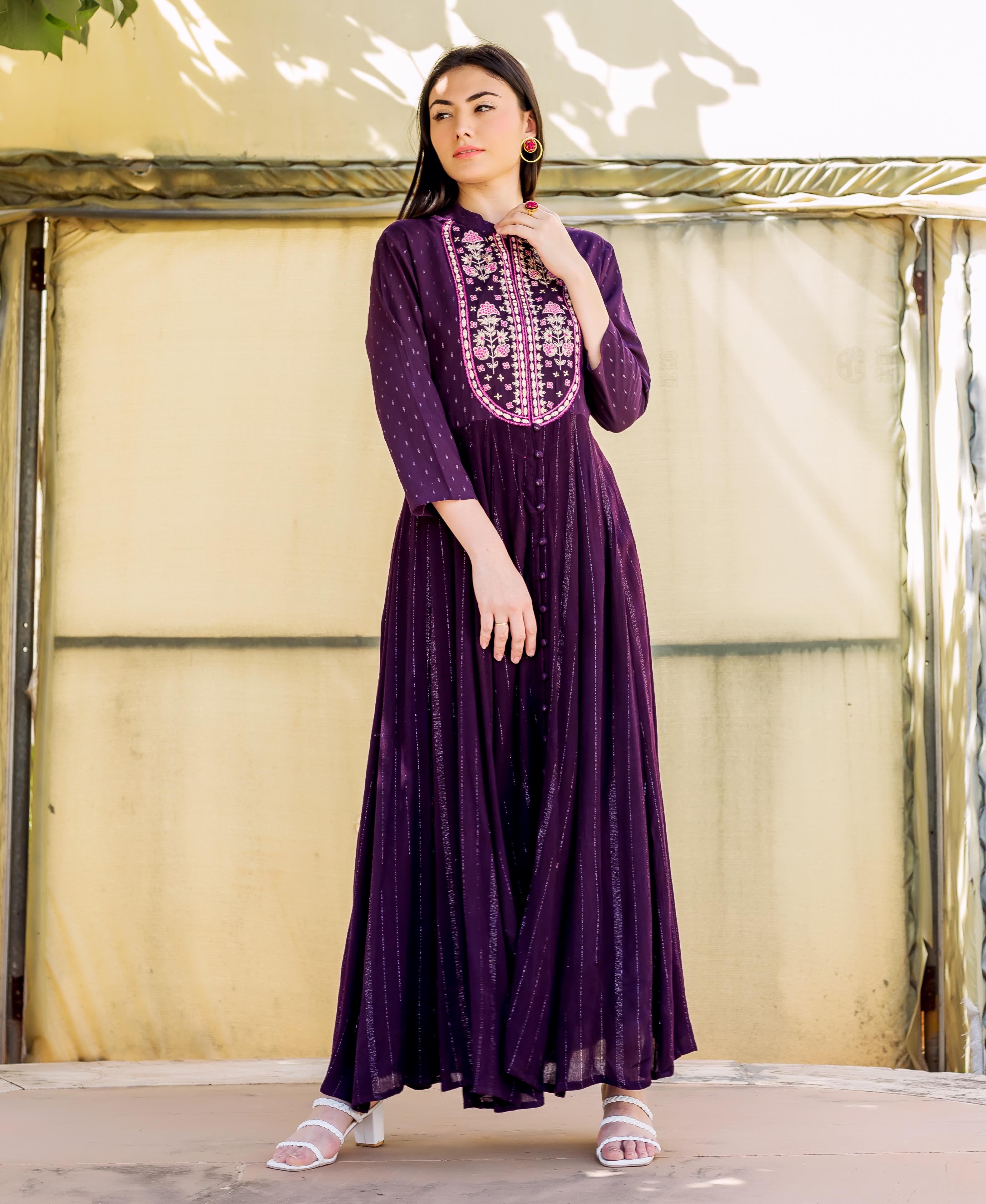 Model in full-length wine Lurex Anarkali dress with pink-and-white embroidered bodice.