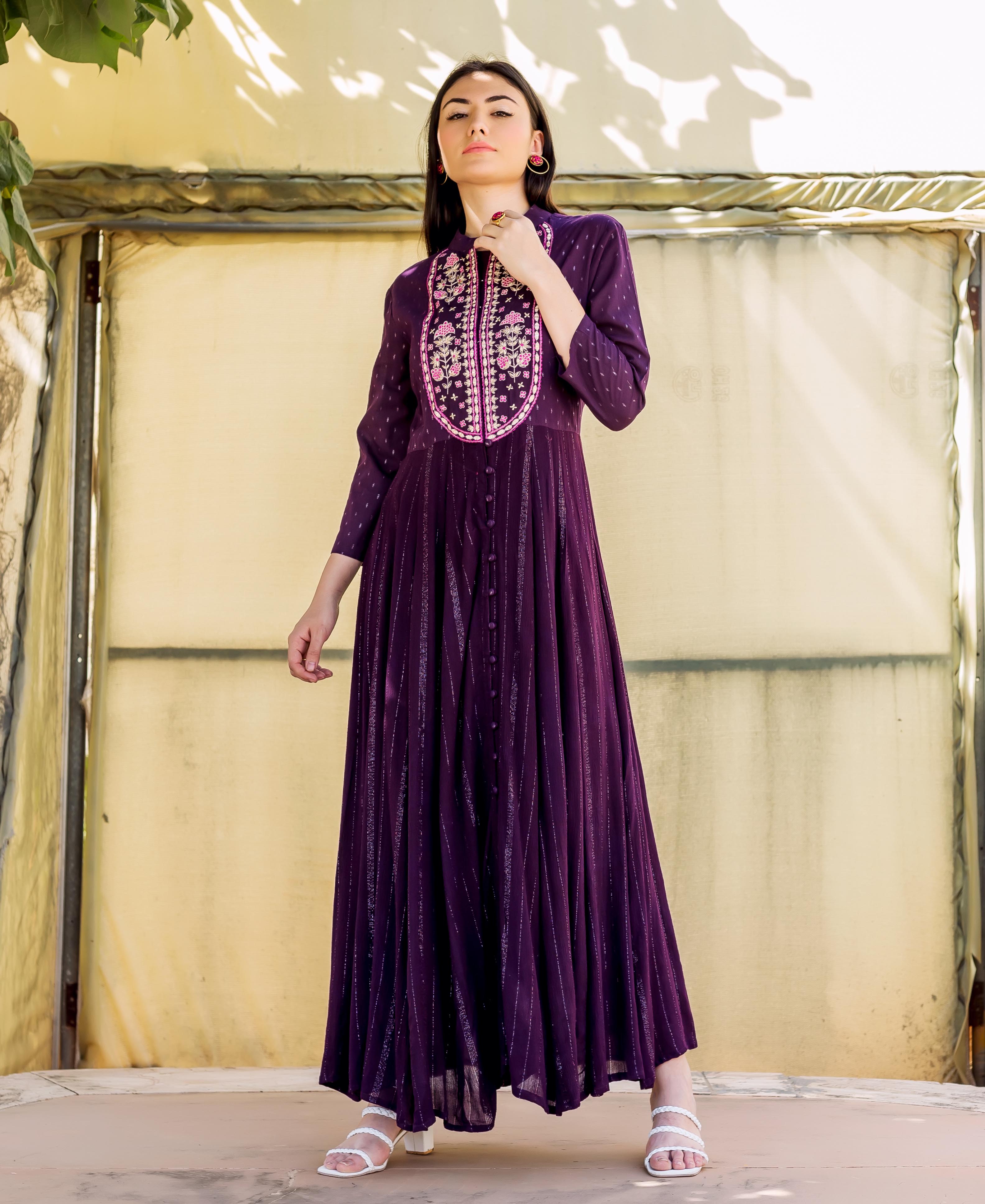 Model in a deep purple anarkali dress, featuring vertical lurex stripes and a floral embroidered yoke.
